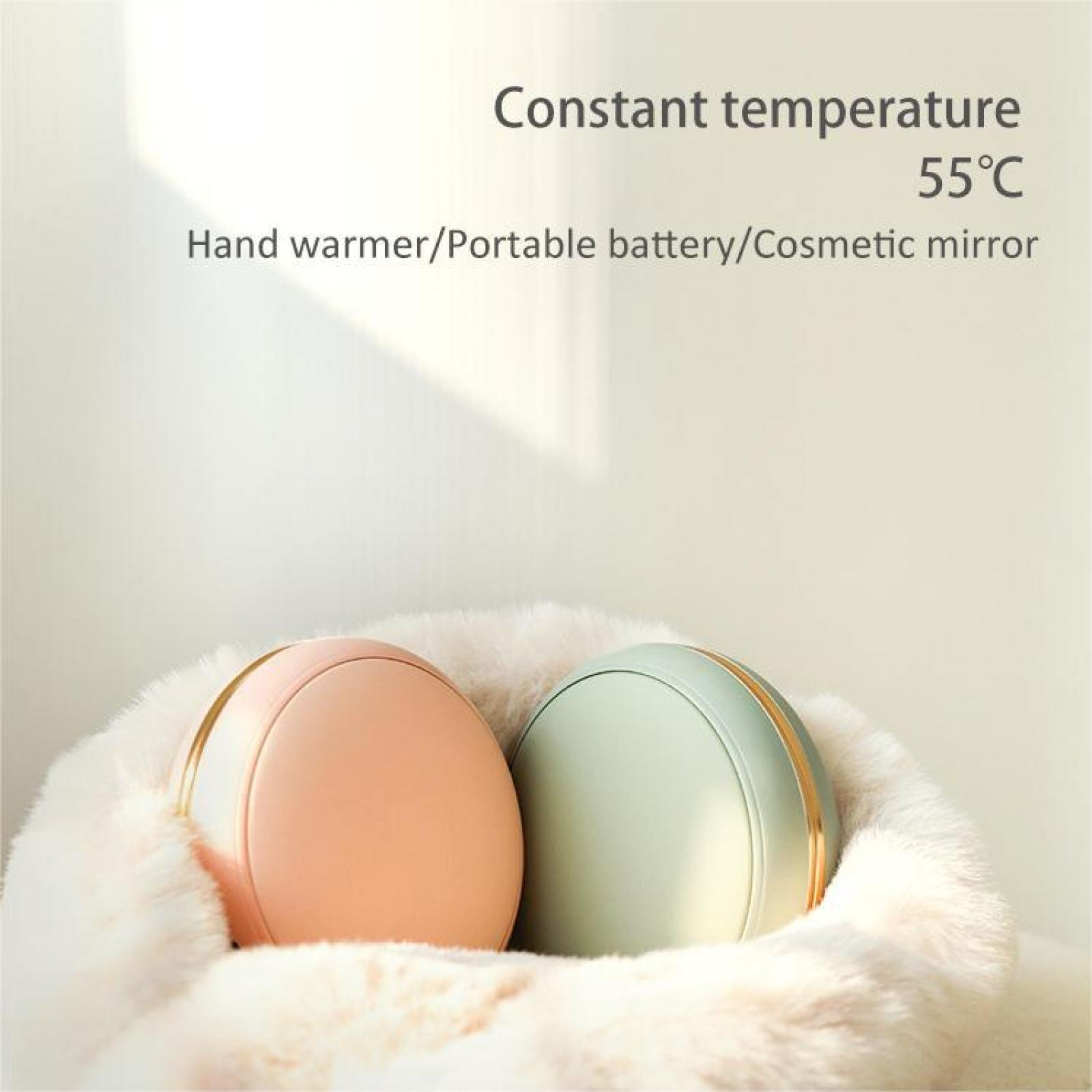 Zwei Handwärmer, rosa und grün, mit goldenen Akzenten, auf flauschigem, weißem Stoff. Text oben: Konstante Temperatur 55°C.