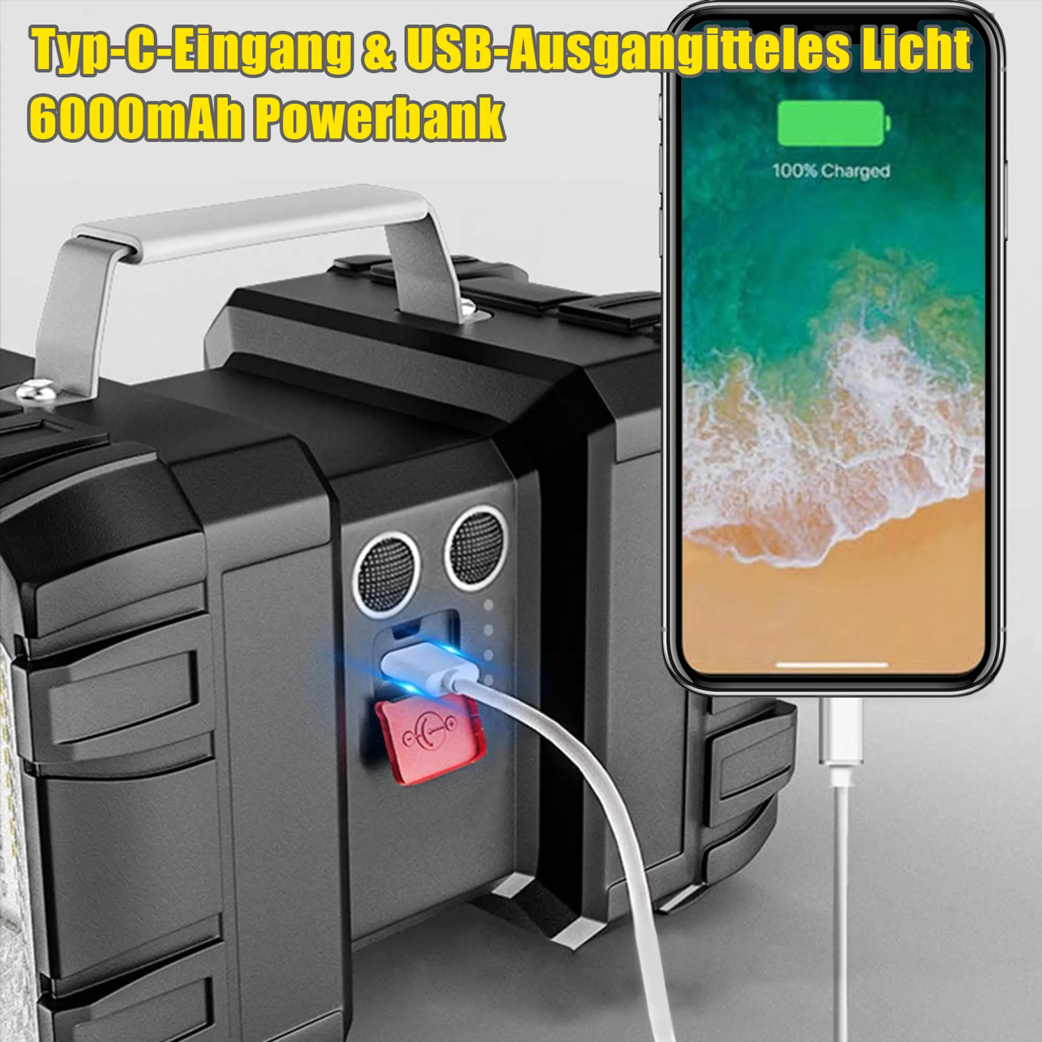 Schwarze Powerbank mit Griff, die ein Telefon auflädt. Das Telefon zeigt 100% geladen an. Weißes Kabel verbindet das Telefon mit der Powerbank.