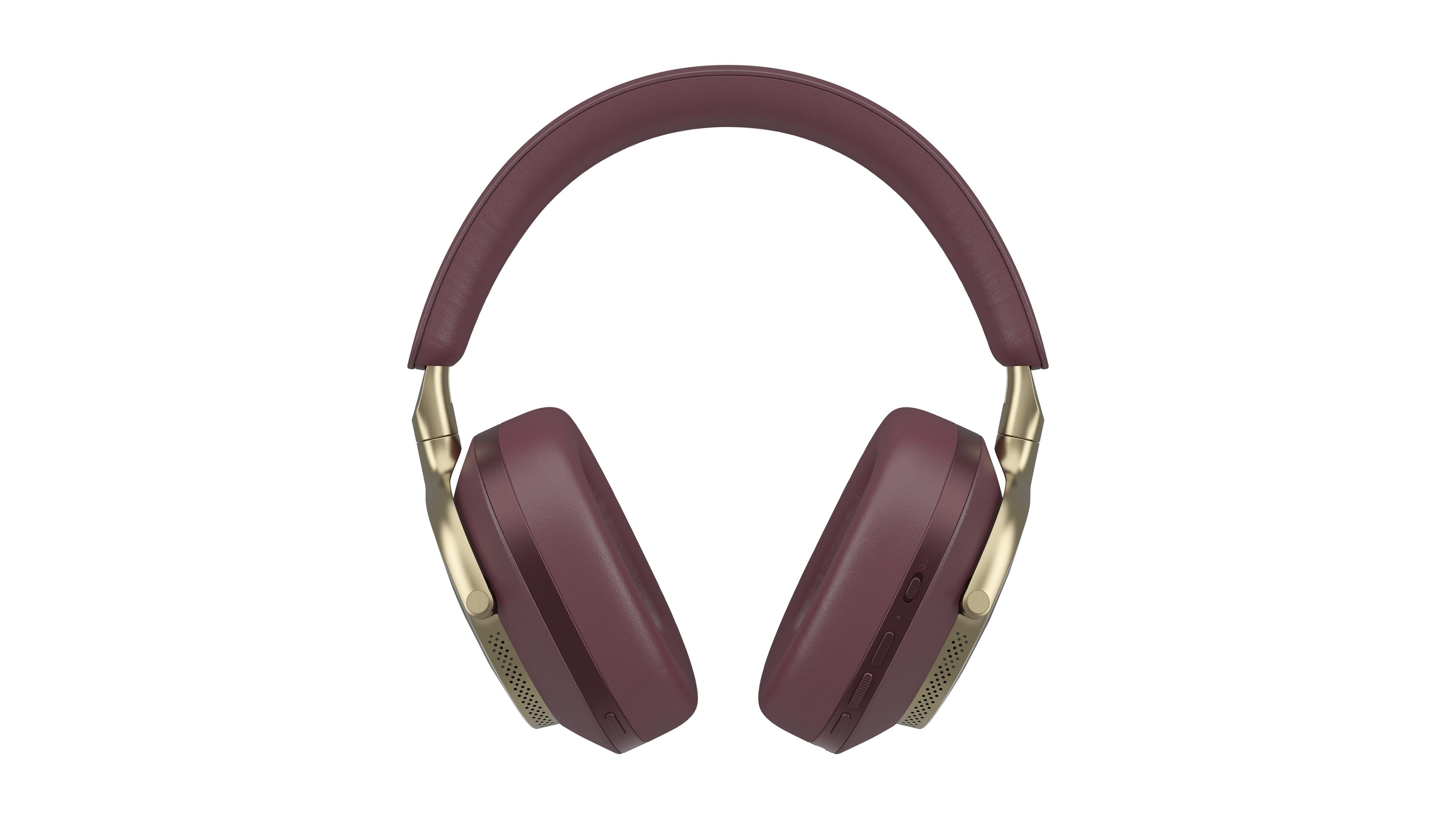 Słuchawki nauszne. Bordowe nauszniki i pałąk, złote ramiona. Białe tło.