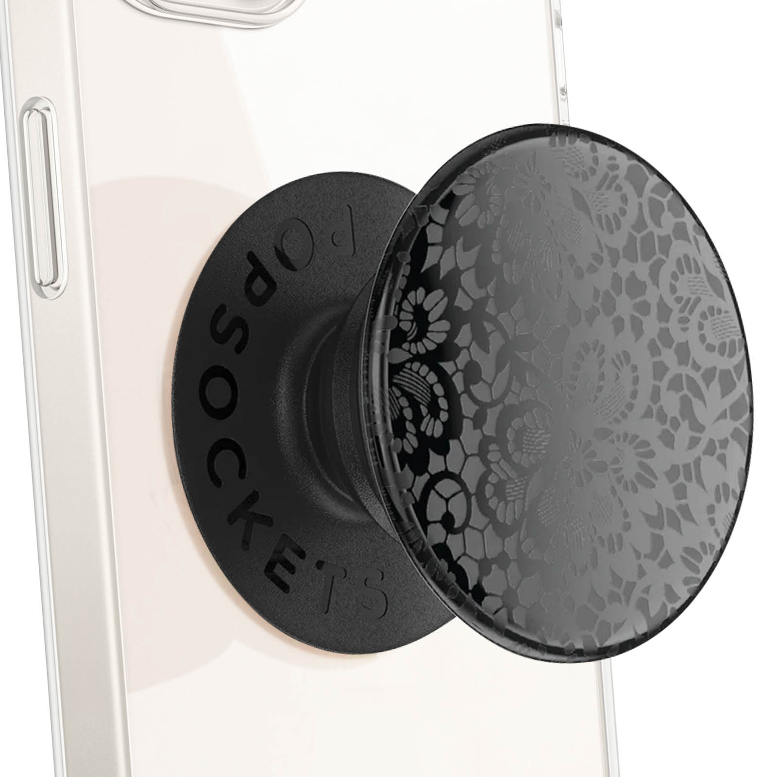 Impugnatura PopSockets nera con design a pizzo attaccata a un telefono bianco. L'impugnatura è circolare e riporta la scritta POPSOCKETS.