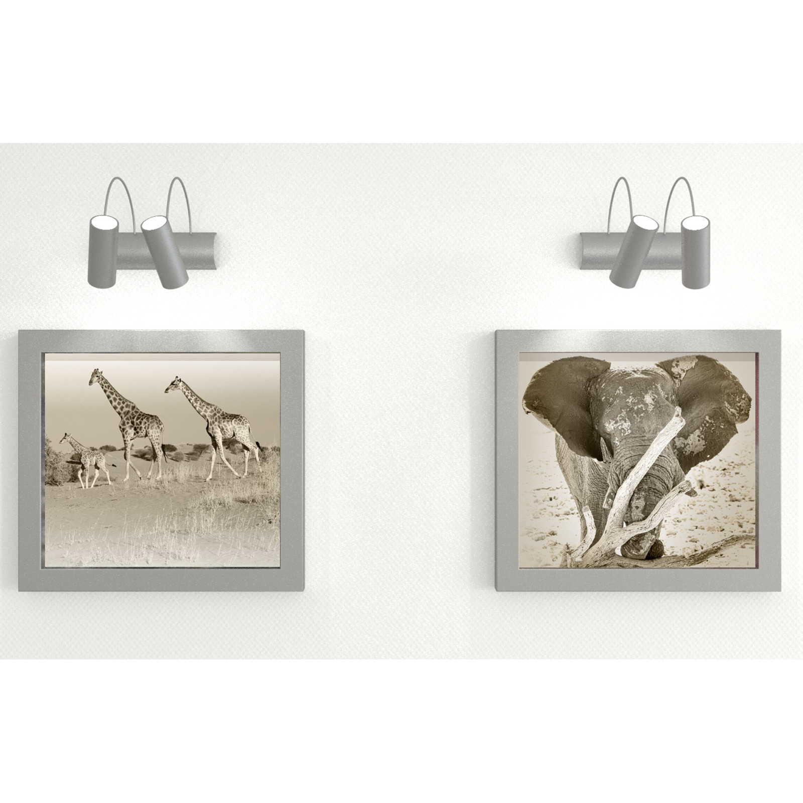 Zwei gerahmte Bilder an einer weißen Wand, eines von Giraffen, das andere von einem Elefanten. Über jedem Bild befinden sich silberne Scheinwerfer.