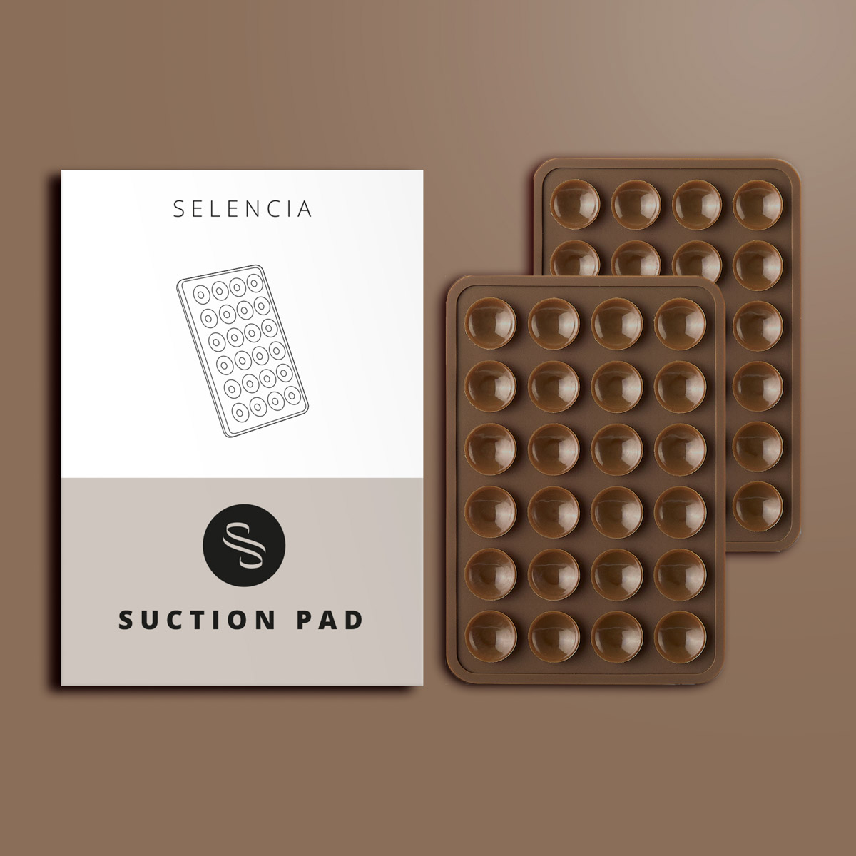 Afbeelding toont een productdoos met een contour van een zuignap en twee bruine siliconen trays met zuignappen.