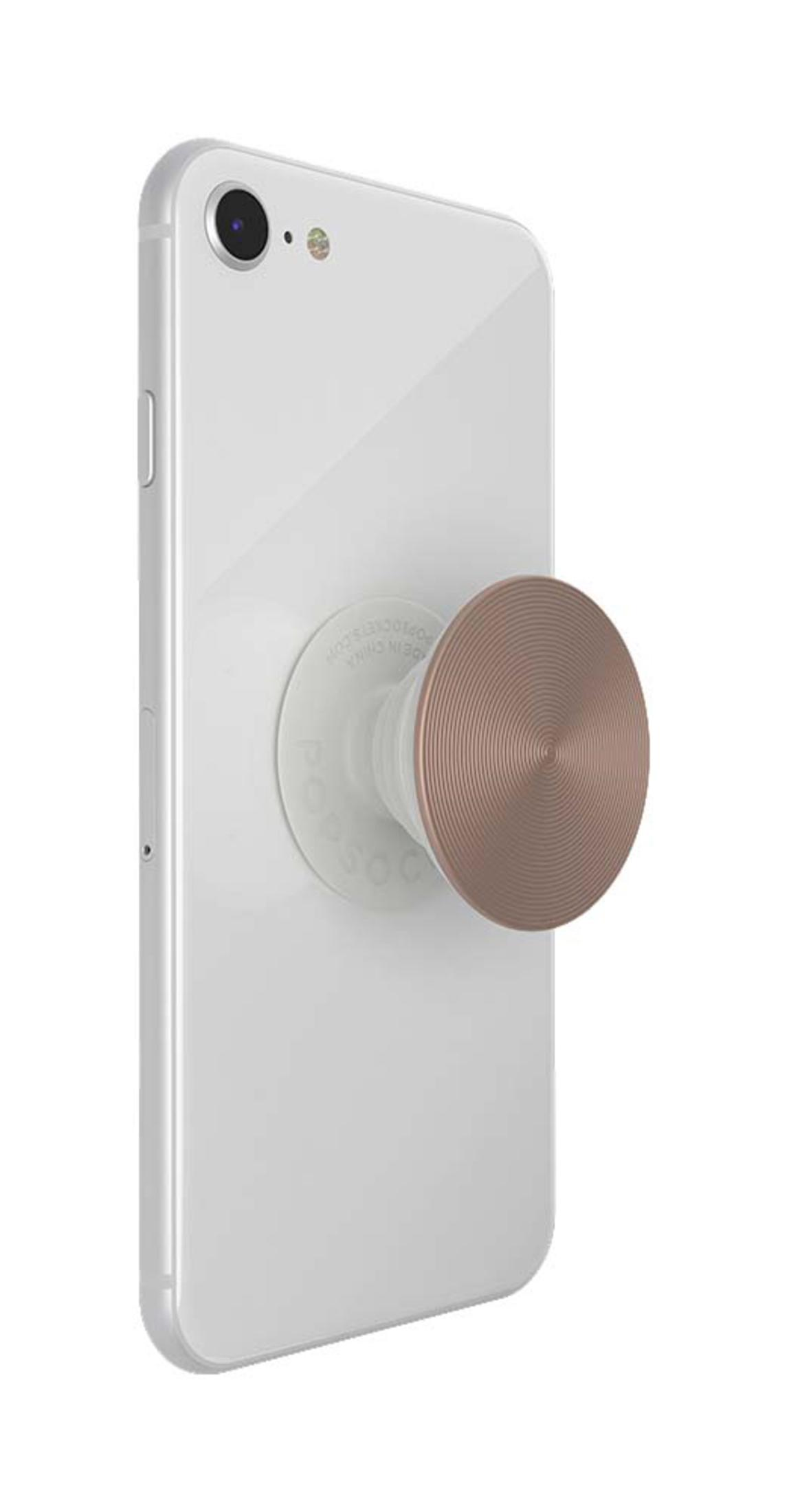 Ein weißes iPhone mit einem roségoldenen PopSocket. Der PopSocket ist kreisförmig und hat eine strukturierte Oberfläche.