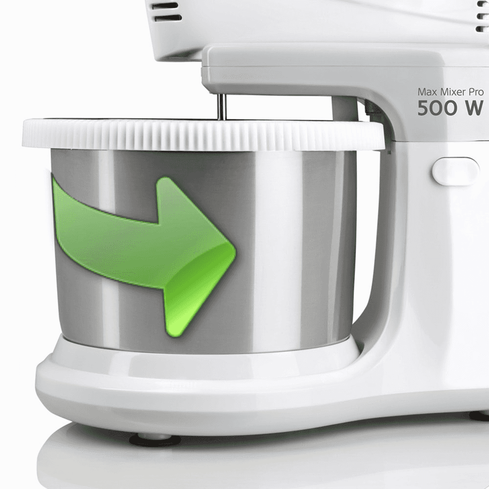 Batidora blanca con un cuenco de acero inoxidable. Una flecha verde indica la dirección. El texto 'Max Mixer Pro 500 W' es visible.