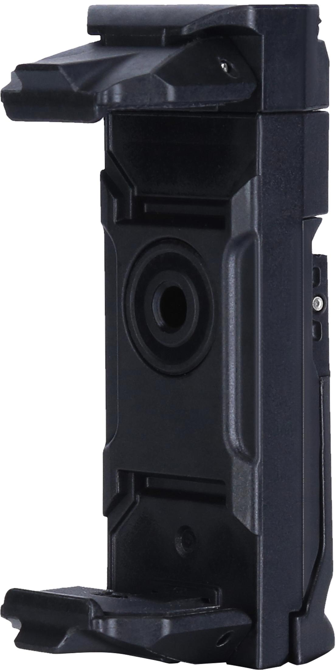 Ein schwarzes Plastikgerät, möglicherweise eine Telefonhalterung, mit geometrischem Design, einschließlich einer kreisförmigen Öffnung.