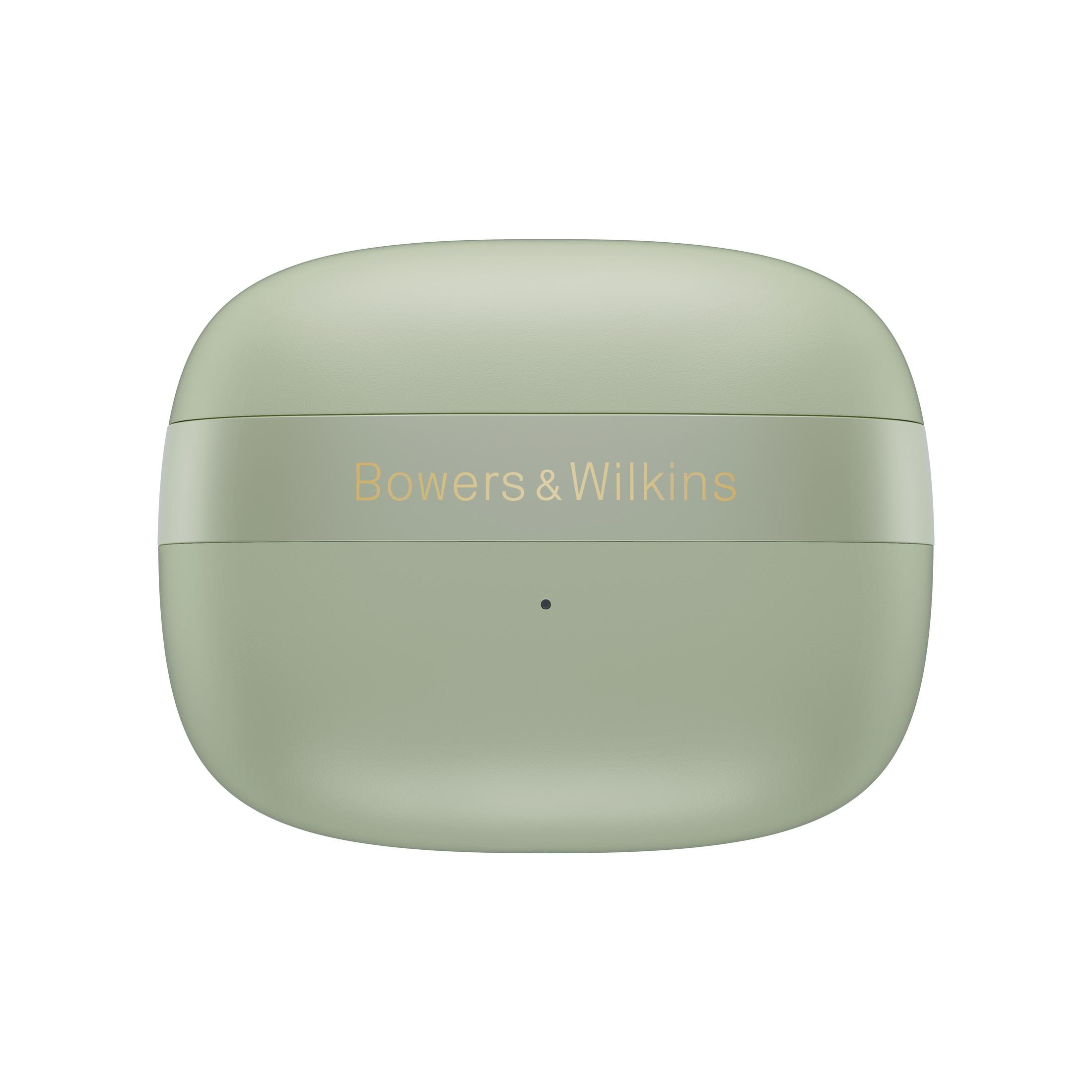 Ein hellgrünes, ovales Gehäuse mit goldenem Schriftzug 'Bowers & Wilkins'. Ein kleiner, schwarzer Punkt unter dem Text.