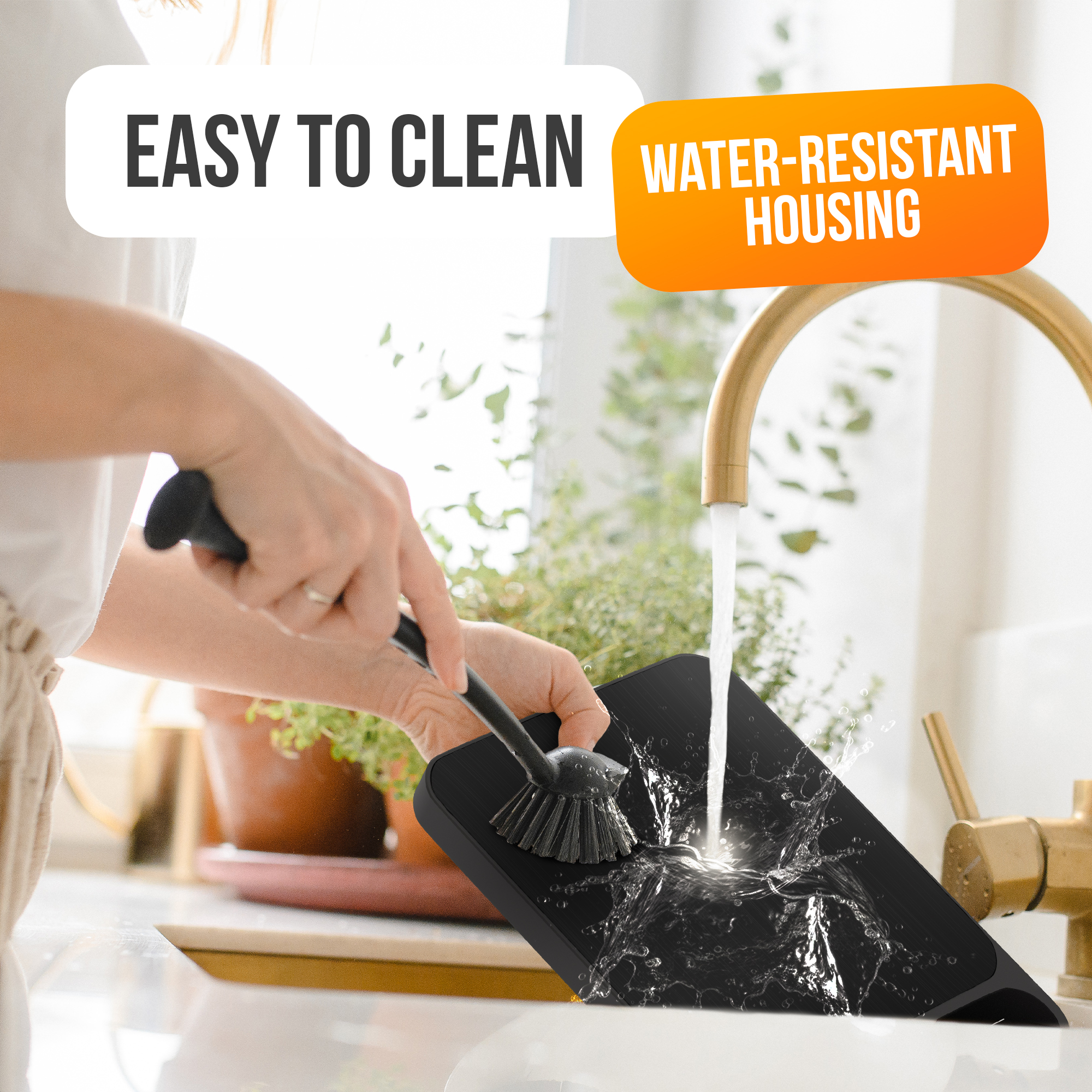 A person cleans a black surface with a brush under running water. Text reads: Easy to Clean, Water-Resistant Housing.