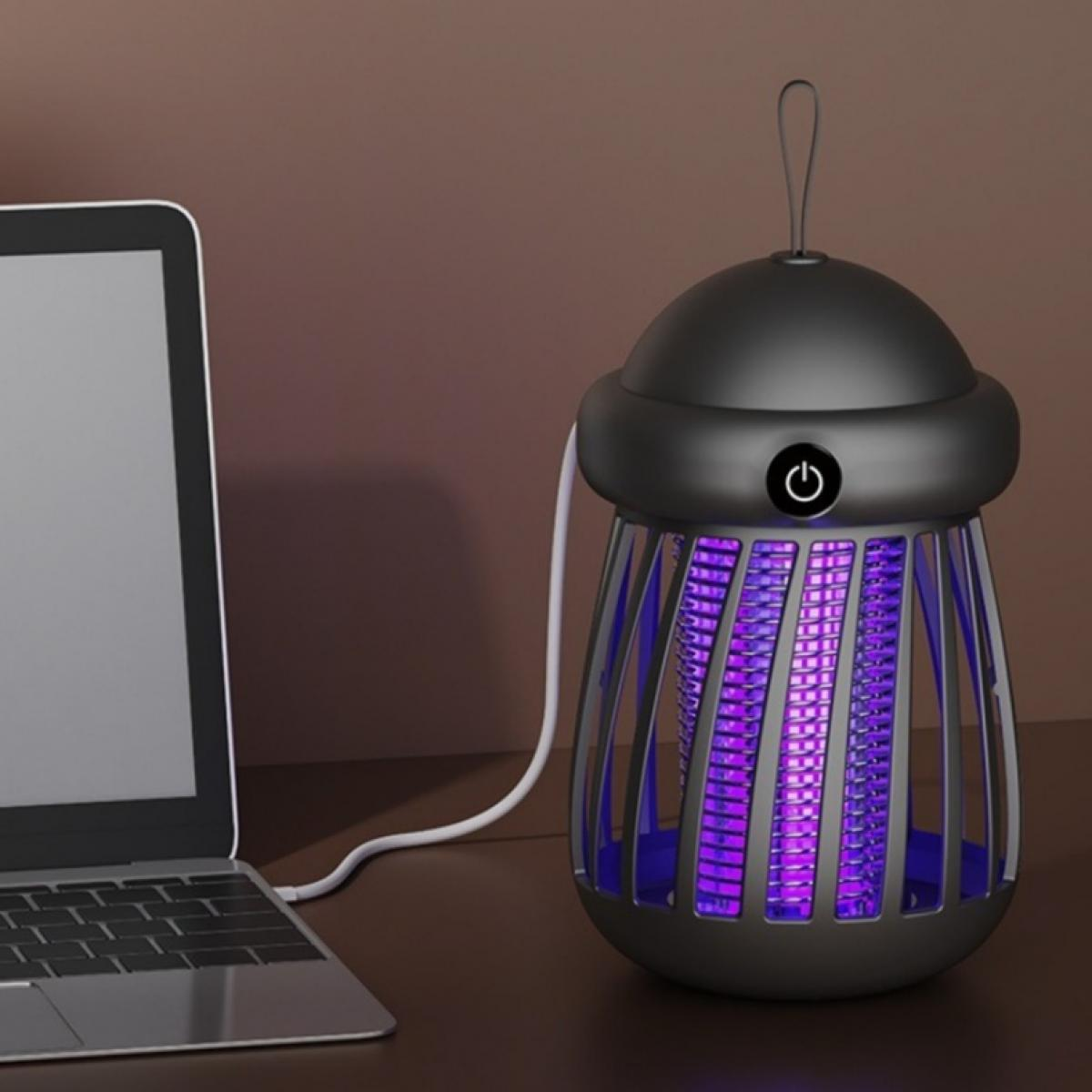 Ein schwarzer Insektenvernichter mit violettem Licht steht auf einem Schreibtisch. Auf der linken Seite befindet sich ein Laptop.