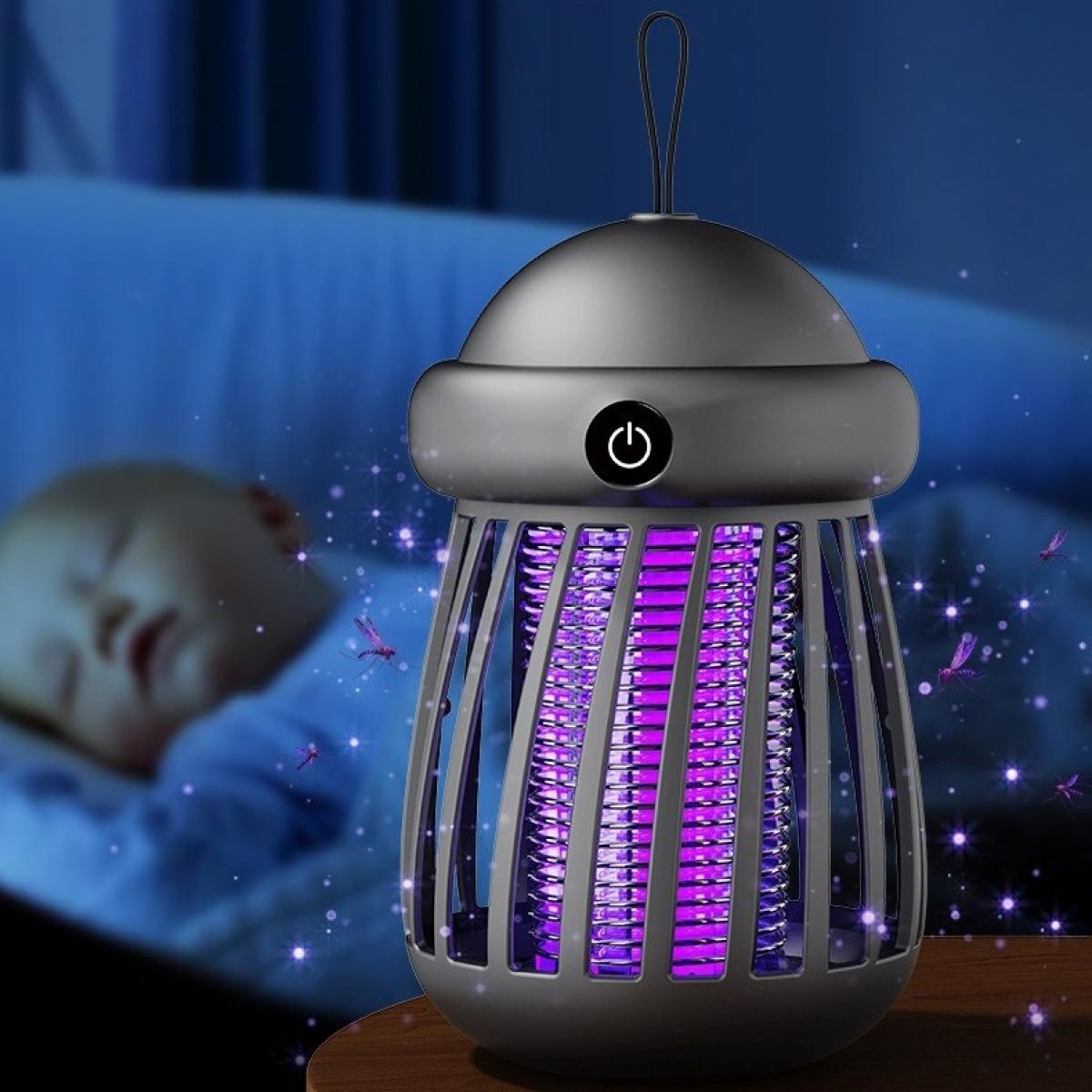 Eine lila leuchtende Mückenvernichtungslampe in der Nähe eines schlafenden Babys. Die Lampe ist dunkelgrau und hat einen Ein-/Ausschalter. Mücken sind da.