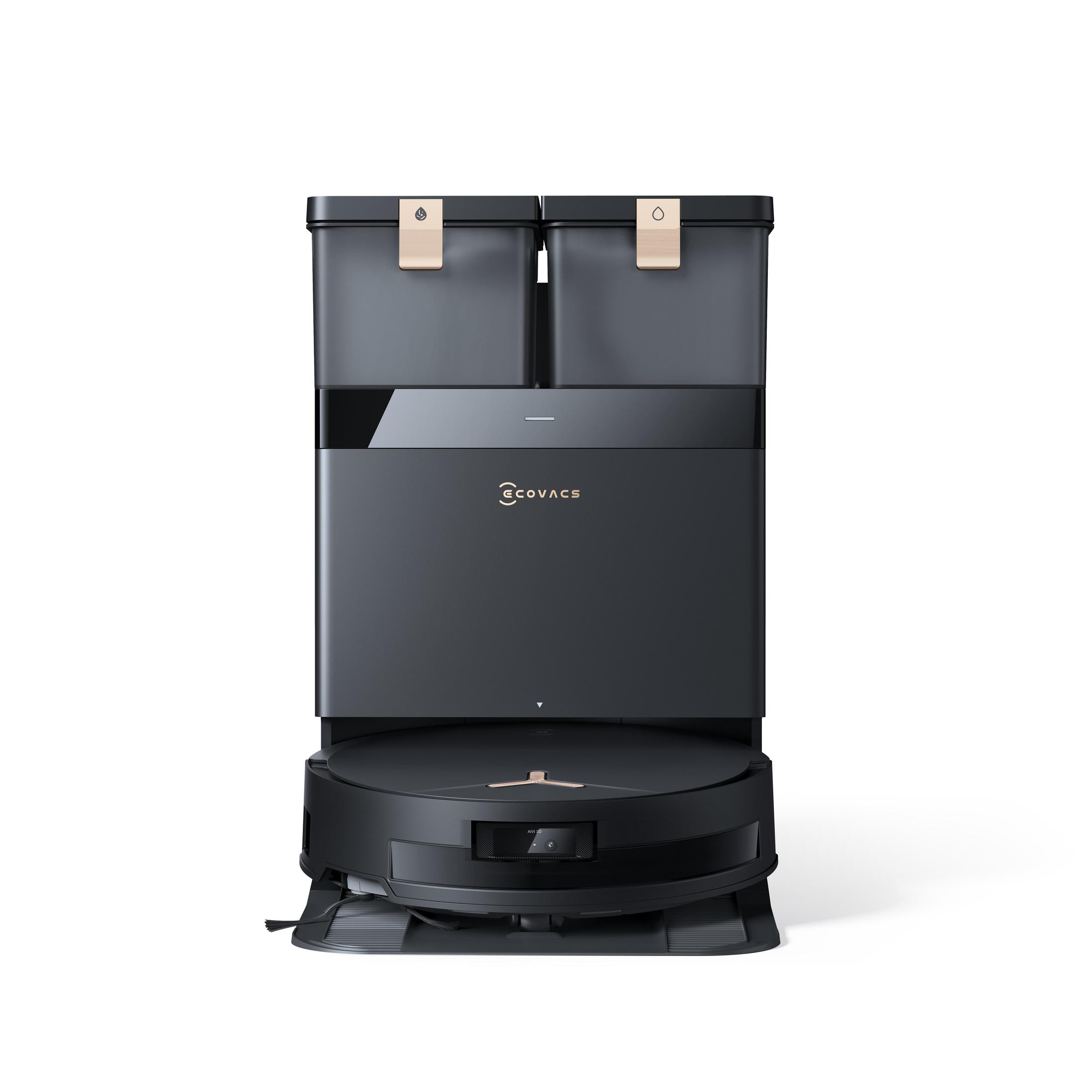 Ein schwarzer und goldener Ecovacs-Roboter-Staubsauger und eine Basisstation auf weißem Hintergrund. Die Basis hat zwei Fächer.