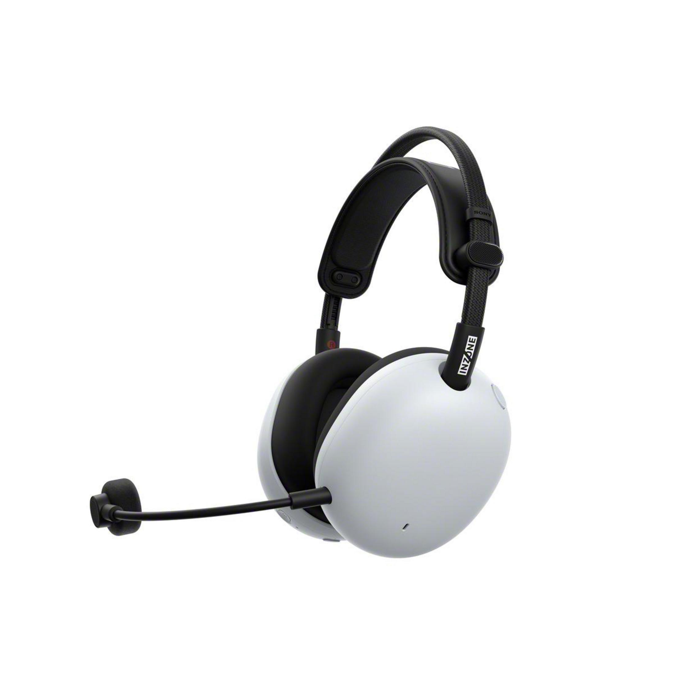 Casque de jeu blanc et noir avec microphone. Le casque a des oreillettes, un bandeau et un micro-perche s'étendant de l'écouteur gauche.
