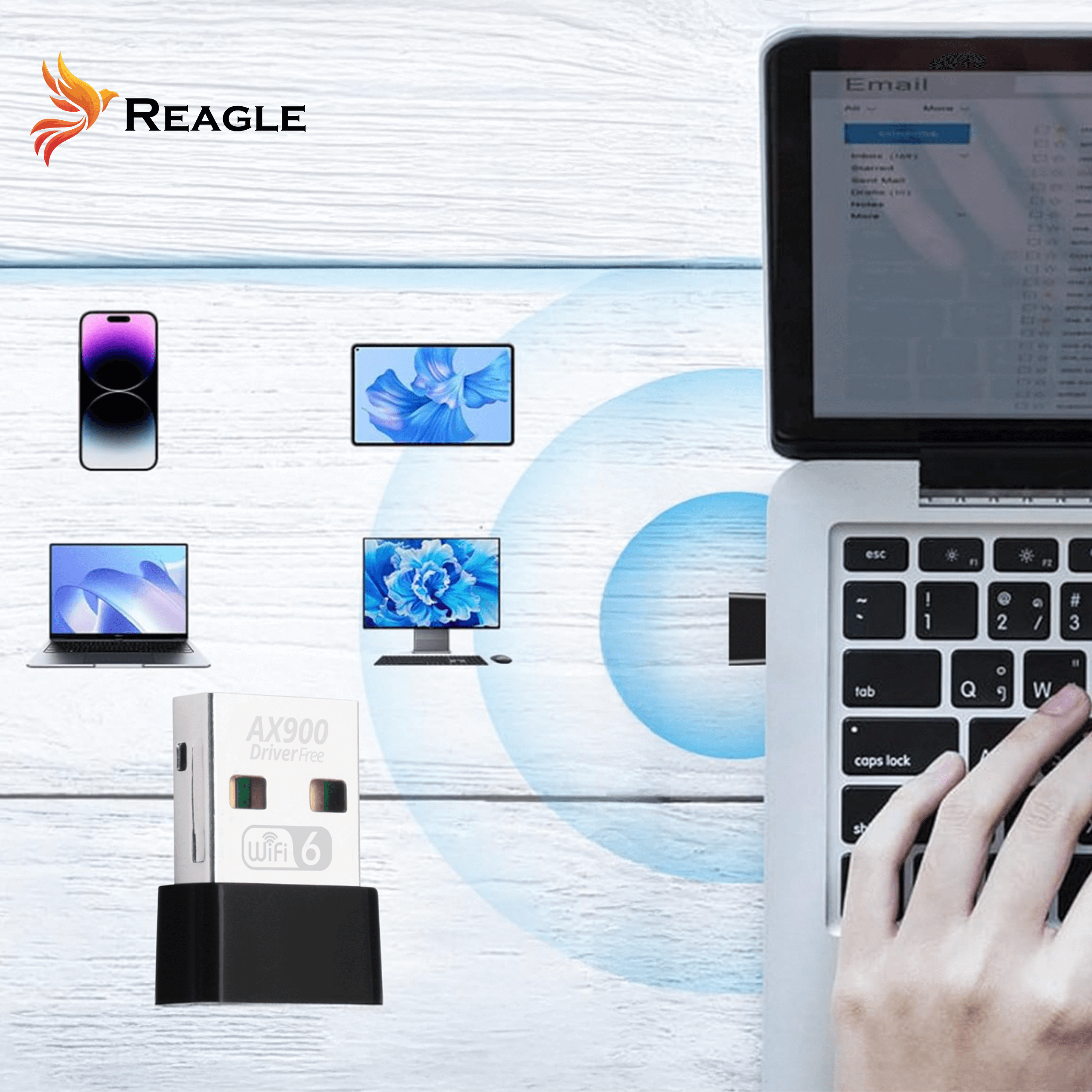 Das Bild zeigt einen Laptop, ein Telefon und einen WLAN-Adapter. Eine Hand tippt auf einer Laptop-Tastatur. Das Reagle-Logo ist oben links.