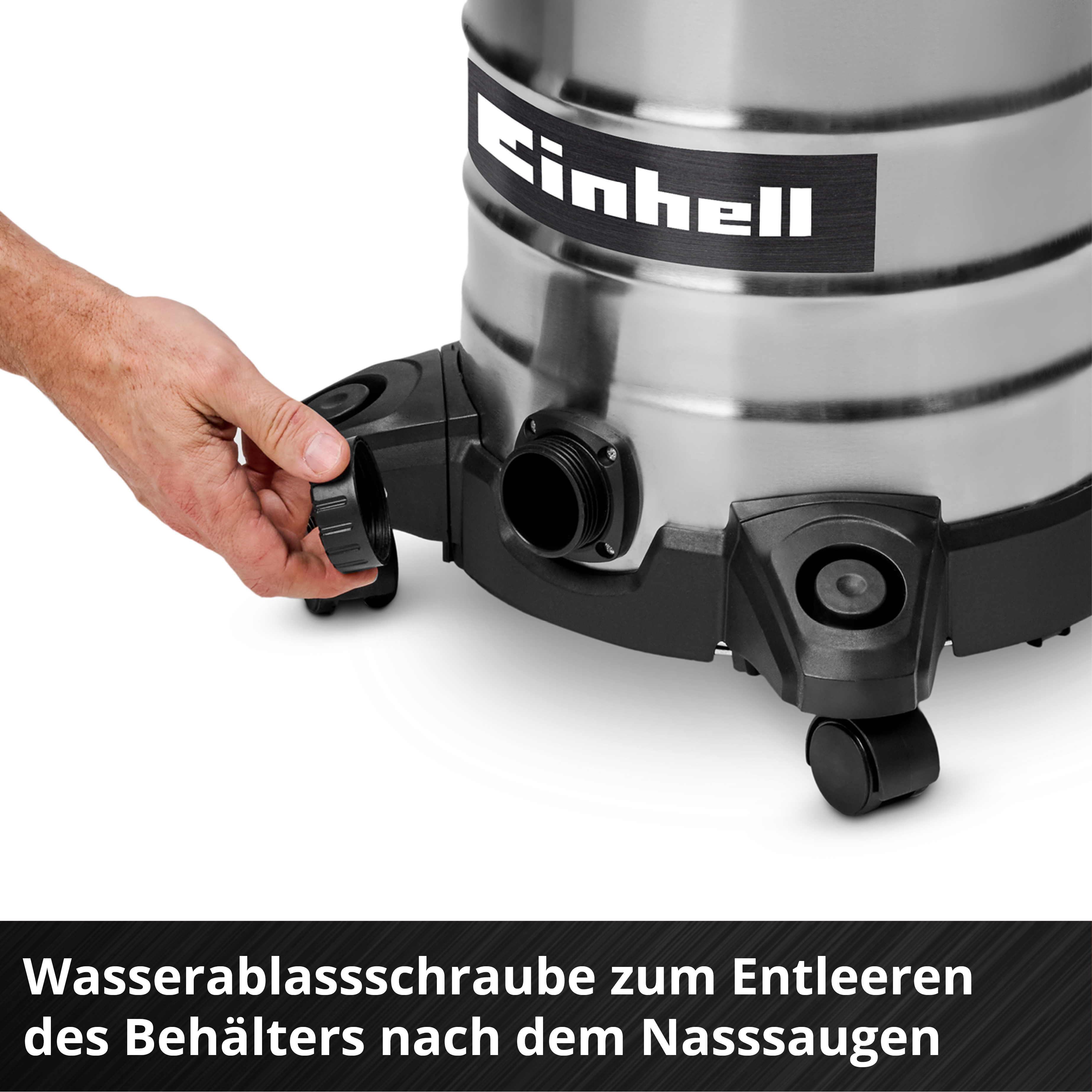 Une main dévisse le bouchon de vidange noir d'un aspirateur en acier inoxydable. Le logo Einhell est visible.