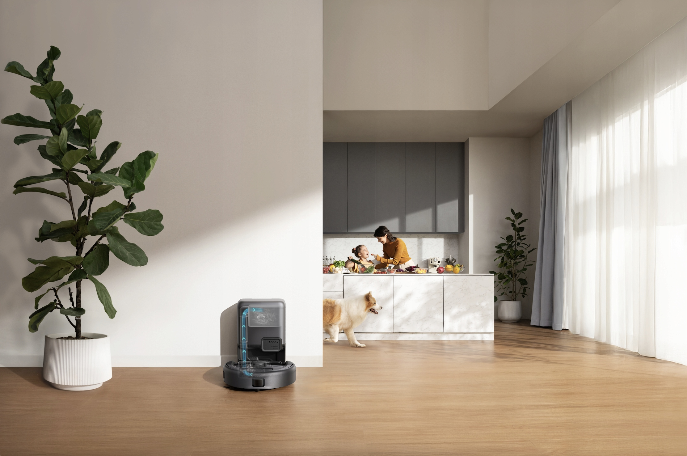 Nowoczesna kuchnia z robotem sprzątającym, kobietą i dzieckiem gotującymi oraz psem. Po lewej duża roślina.