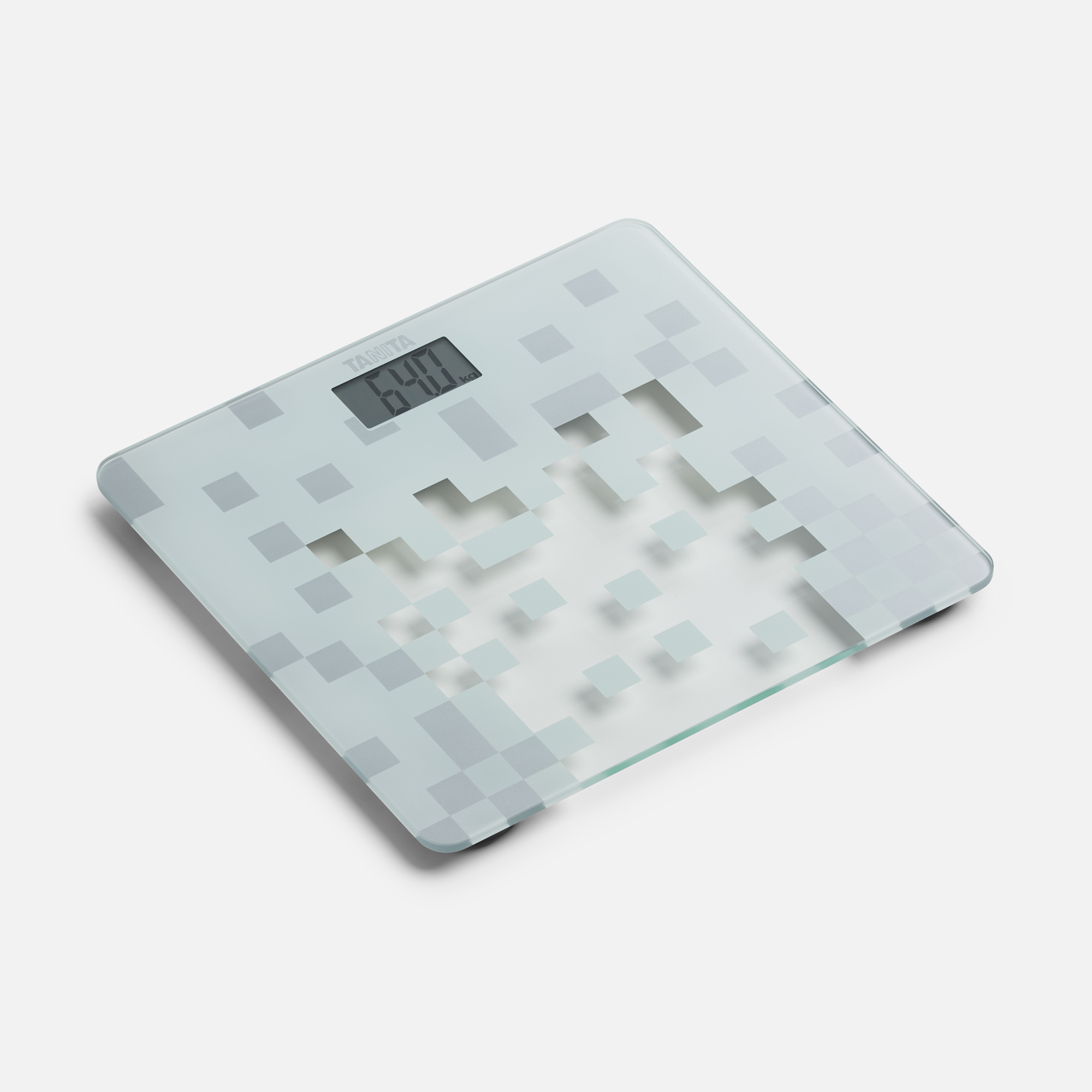 Een digitale badkamerweegschaal met een pixelachtig ontwerp. Het display toont 64,0 kg. De merknaam TANITA staat bovenaan.