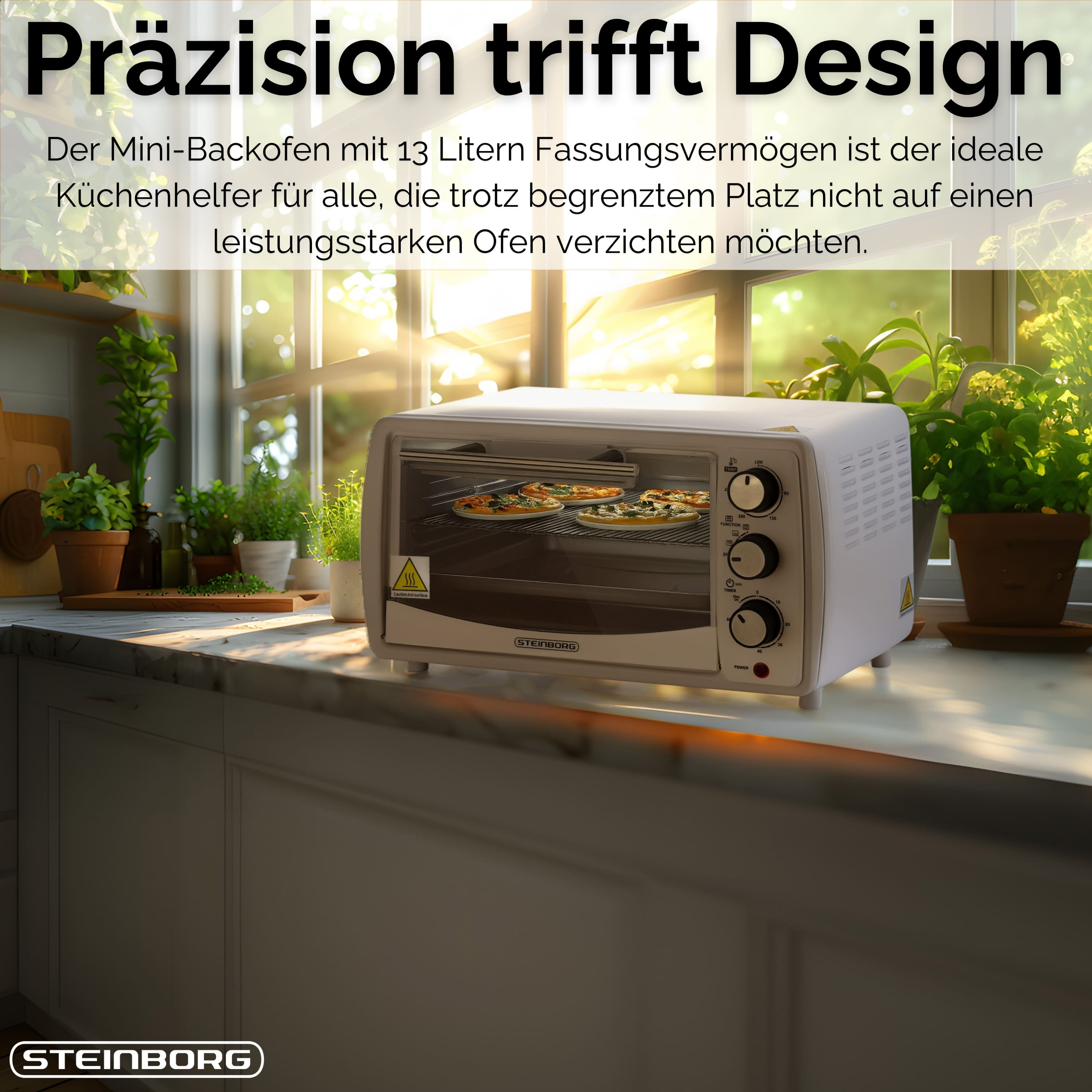 Ein weißer Mini-Ofen mit Pizzen, auf einer Theke mit Pflanzen im Hintergrund und Text oben.