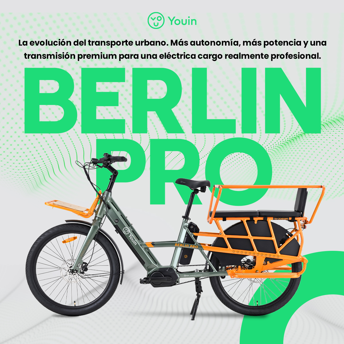 Una bicicleta de carga eléctrica, gris y naranja, se muestra sobre un fondo verde con el texto 'BERLIN PRO'.