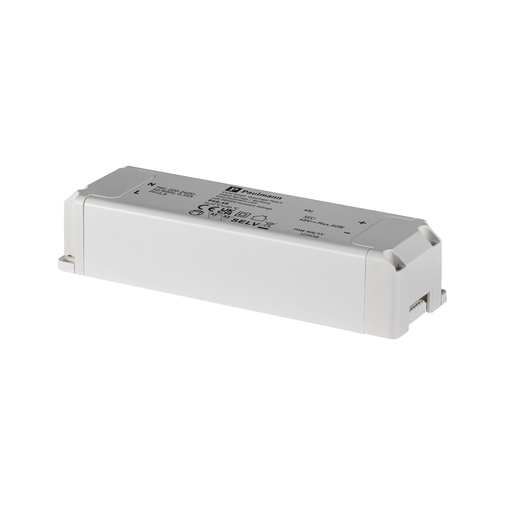 Un appareil électronique rectangulaire blanc, possiblement un driver, avec des étiquettes et le logo Paulmann, sur une surface blanche.