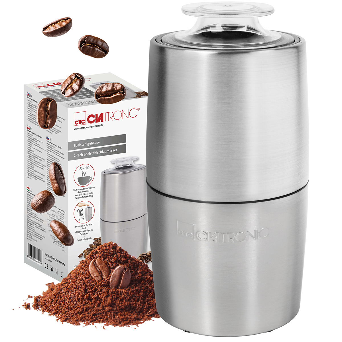 Ein Edelstahl-Kaffeemühle wird neben einer Box und einem Haufen Kaffeepulver und -bohnen angezeigt.