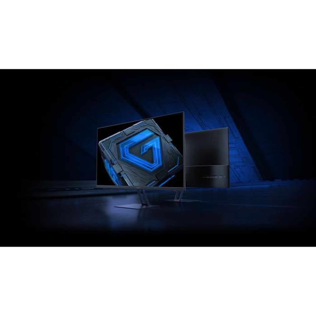 Monitor komputera wyświetla niebiesko-czarny wzór w kształcie litery G. Obok stoi czarna obudowa komputera. Tło jest ciemne.