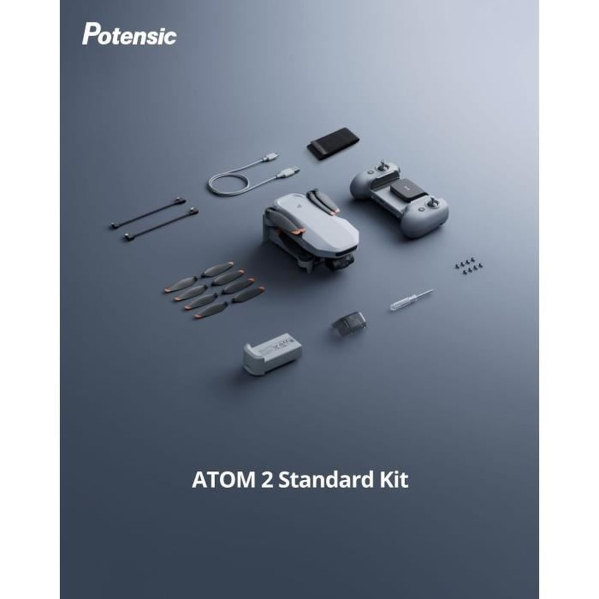 Zestaw drona z dronem, pilotem, ładowarką, śmigłami i kablami na ciemnoszarym tle. Zestaw oznaczony jako ATOM 2 Standard Kit.