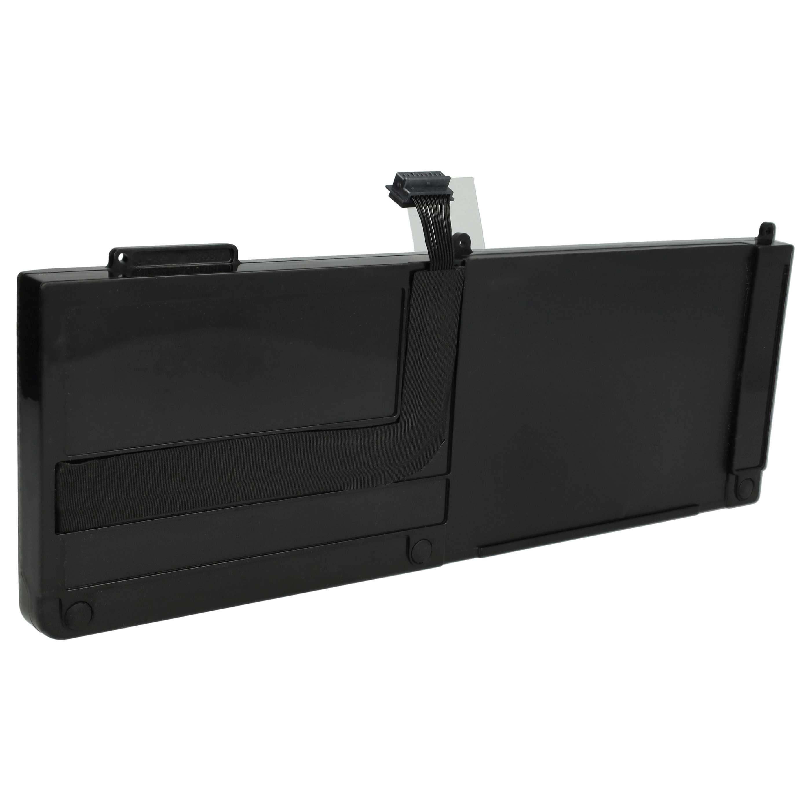 Ein schwarzer Laptop-Akku liegt auf weißem Grund. Ein schwarzer Stecker und ein schwarzes Gewebe sind sichtbar.
