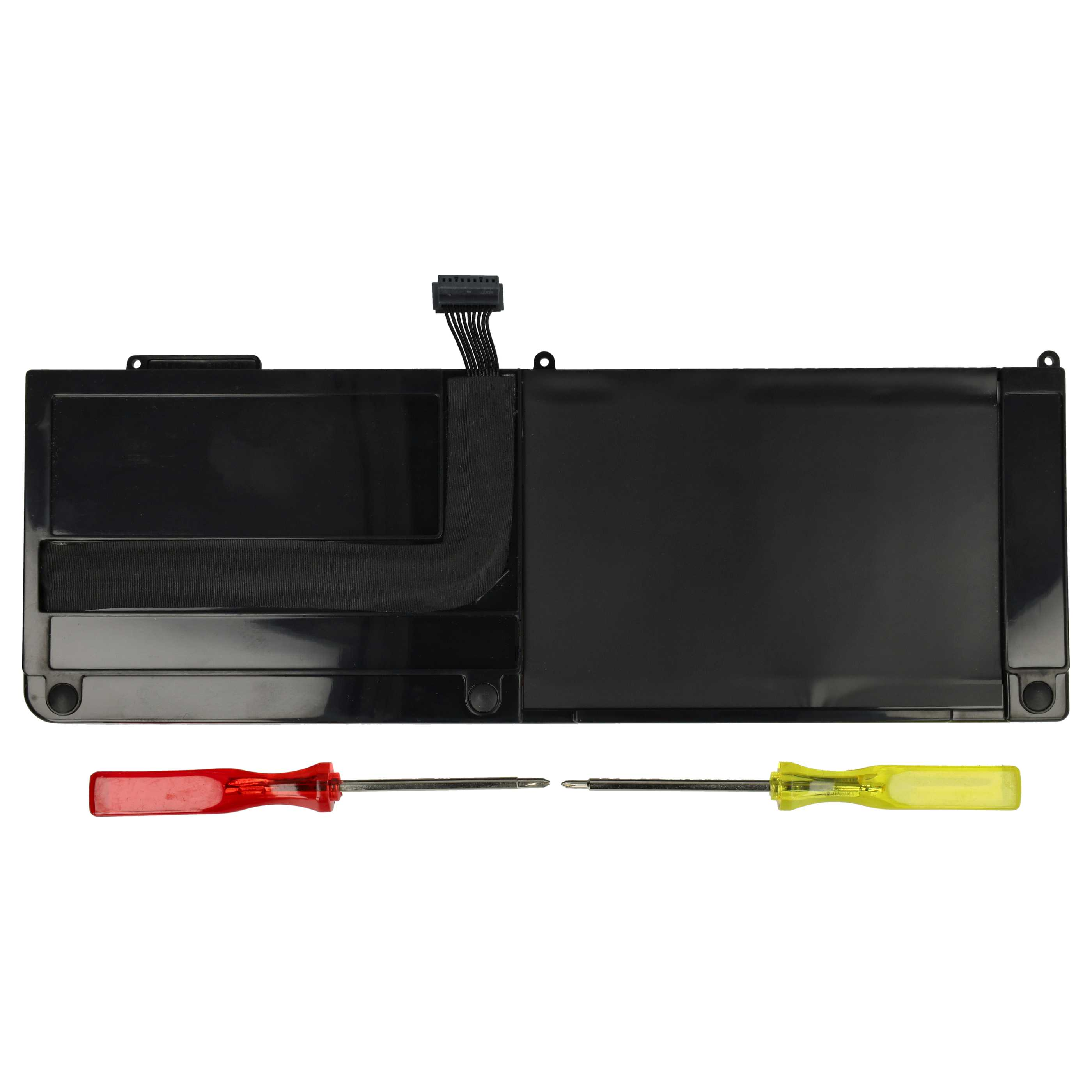 Ein schwarzer Laptop-Akku mit zwei Schraubenziehern, einem roten und einem gelben, vor weißem Hintergrund.