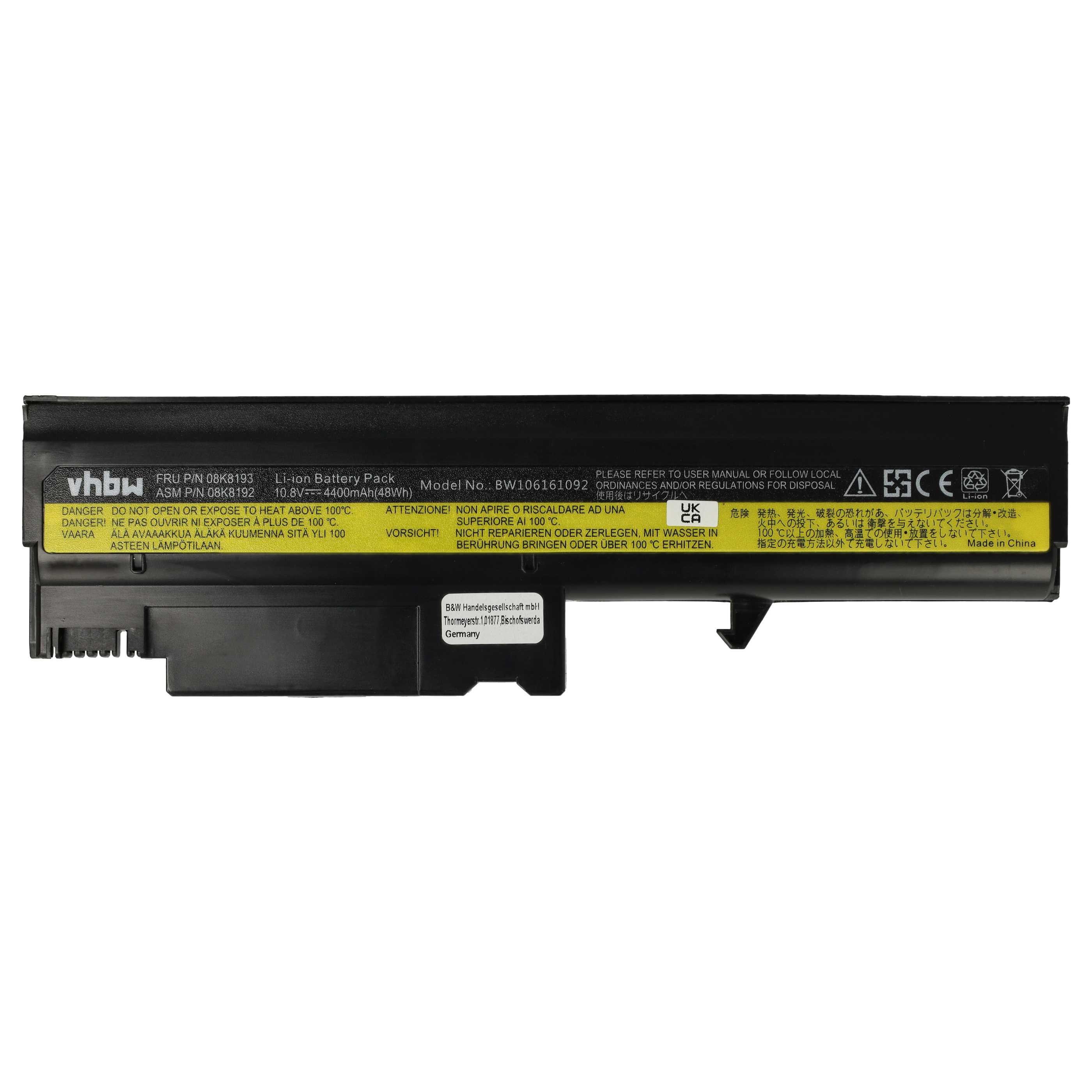 Una batteria per laptop nera e gialla con etichette di testo, avvertenze ed etichetta del prodotto.