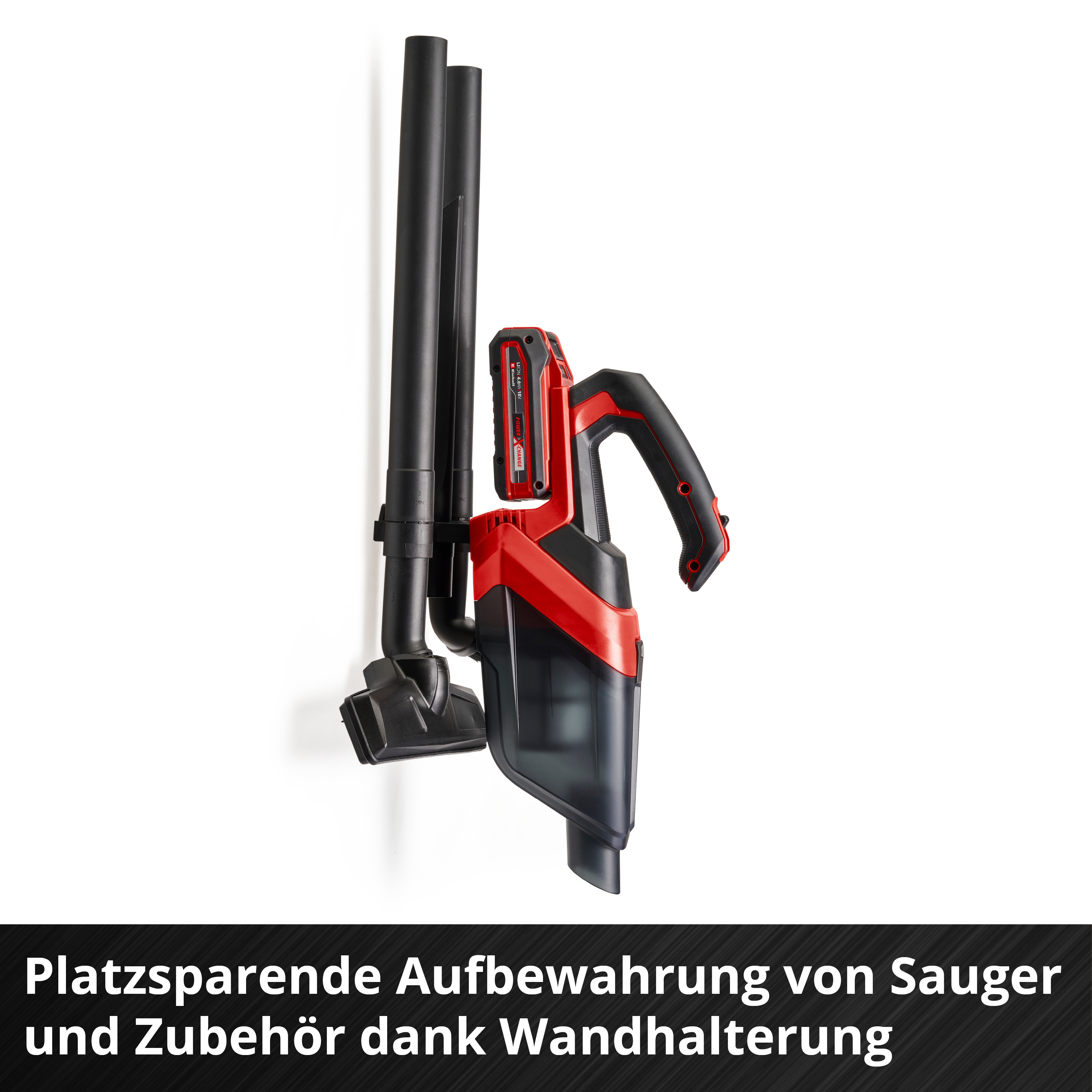 Ein roter und schwarzer Akku-Staubsauger ist an einer weißen Wand mit schwarzen Rohren montiert. Text unten.