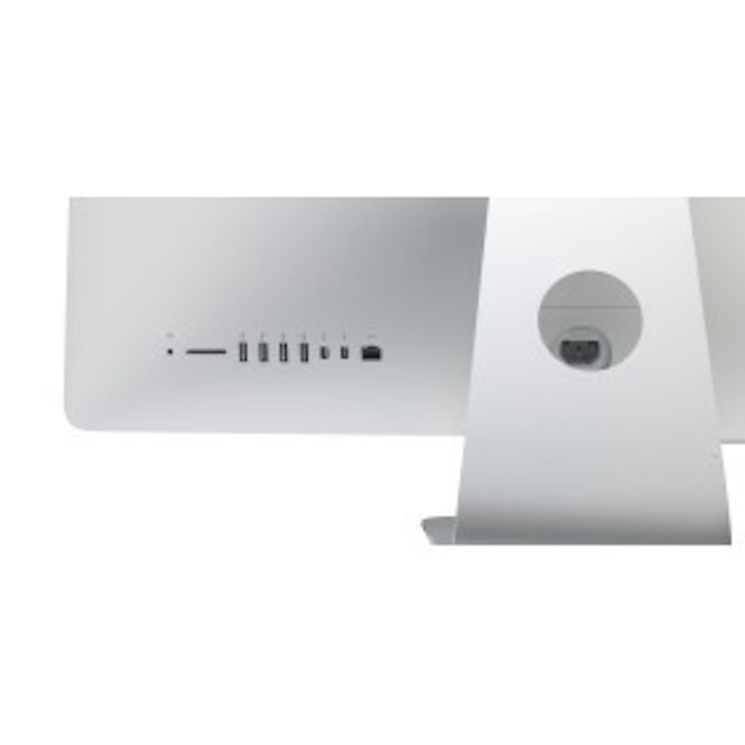 Tył srebrnego iMaca. Posiada porty i okrągłe mocowanie podstawy. Białe tło.