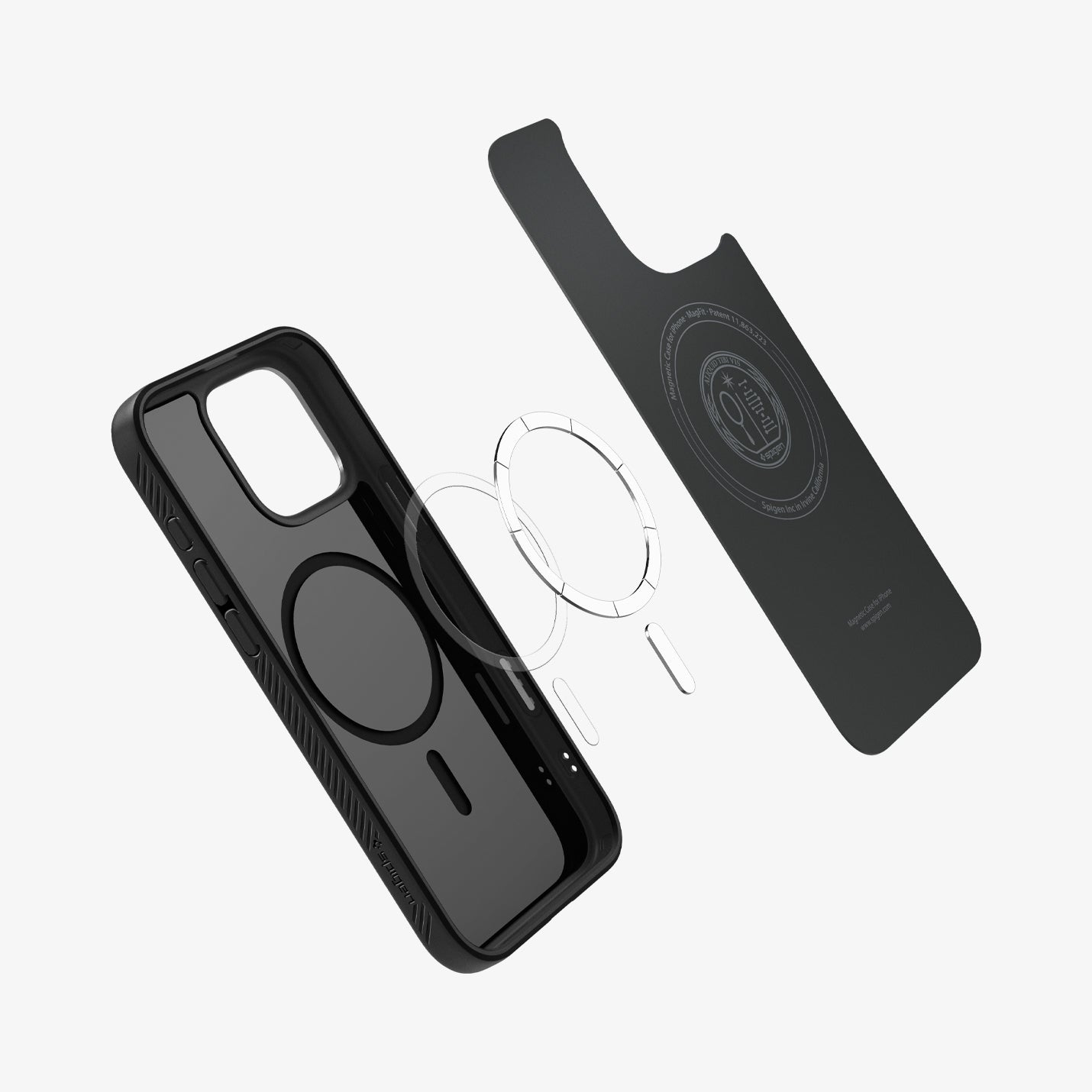 Custodia nera con cerchio trasparente, parte posteriore separata e due accessori ad anello trasparenti su sfondo bianco.