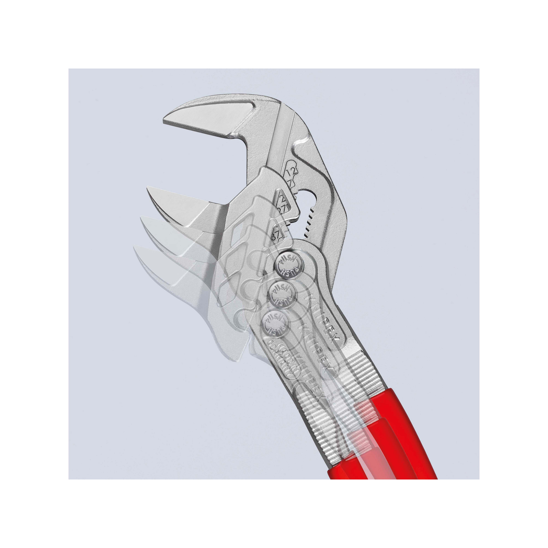 Srebrny klucz nastawny z czerwonymi uchwytami, pokazany z efektem rozmycia ruchu. Tło jest jasnoniebieskie.