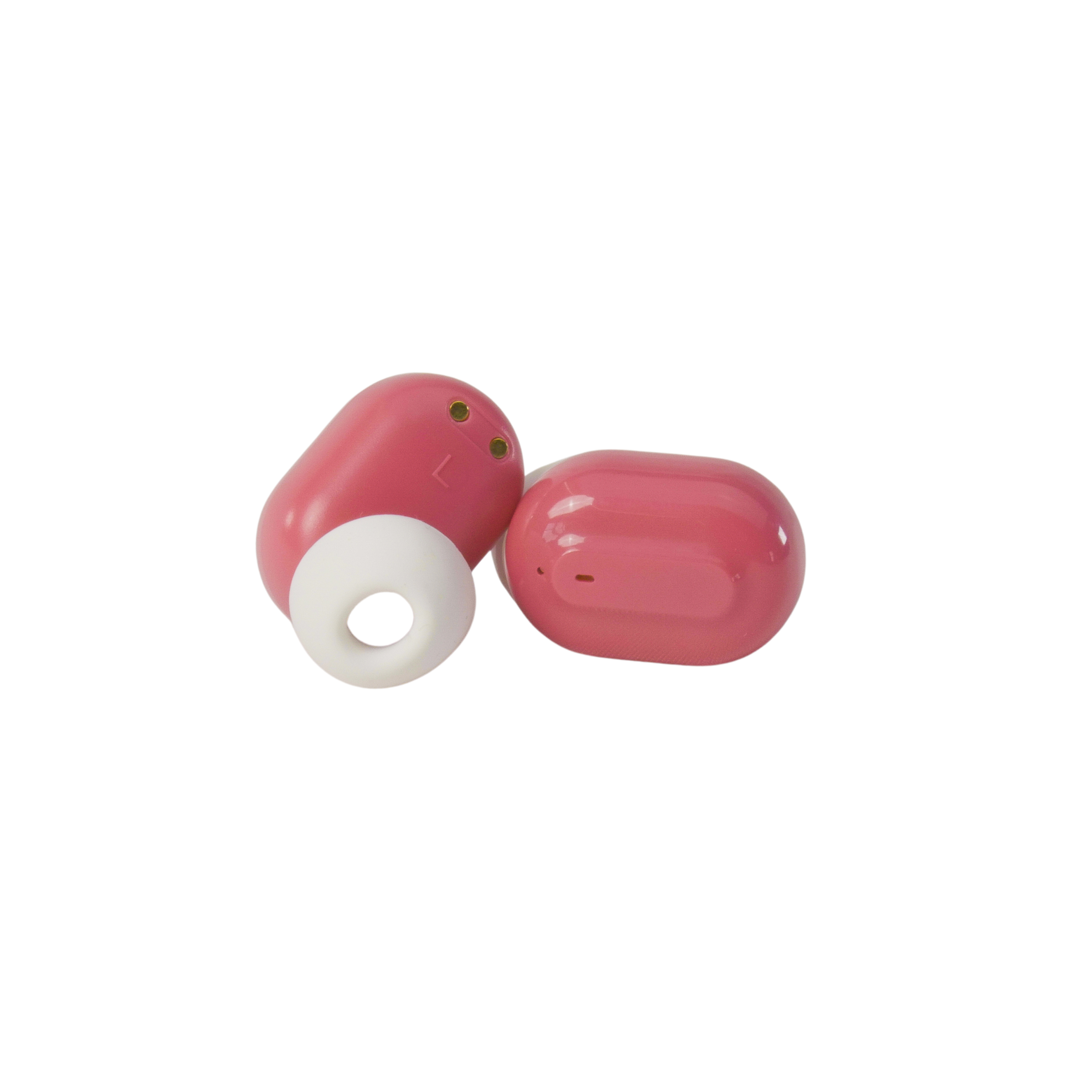 Two pink earbuds with white ear tips lie on a white background. One earbud has a circular tip.