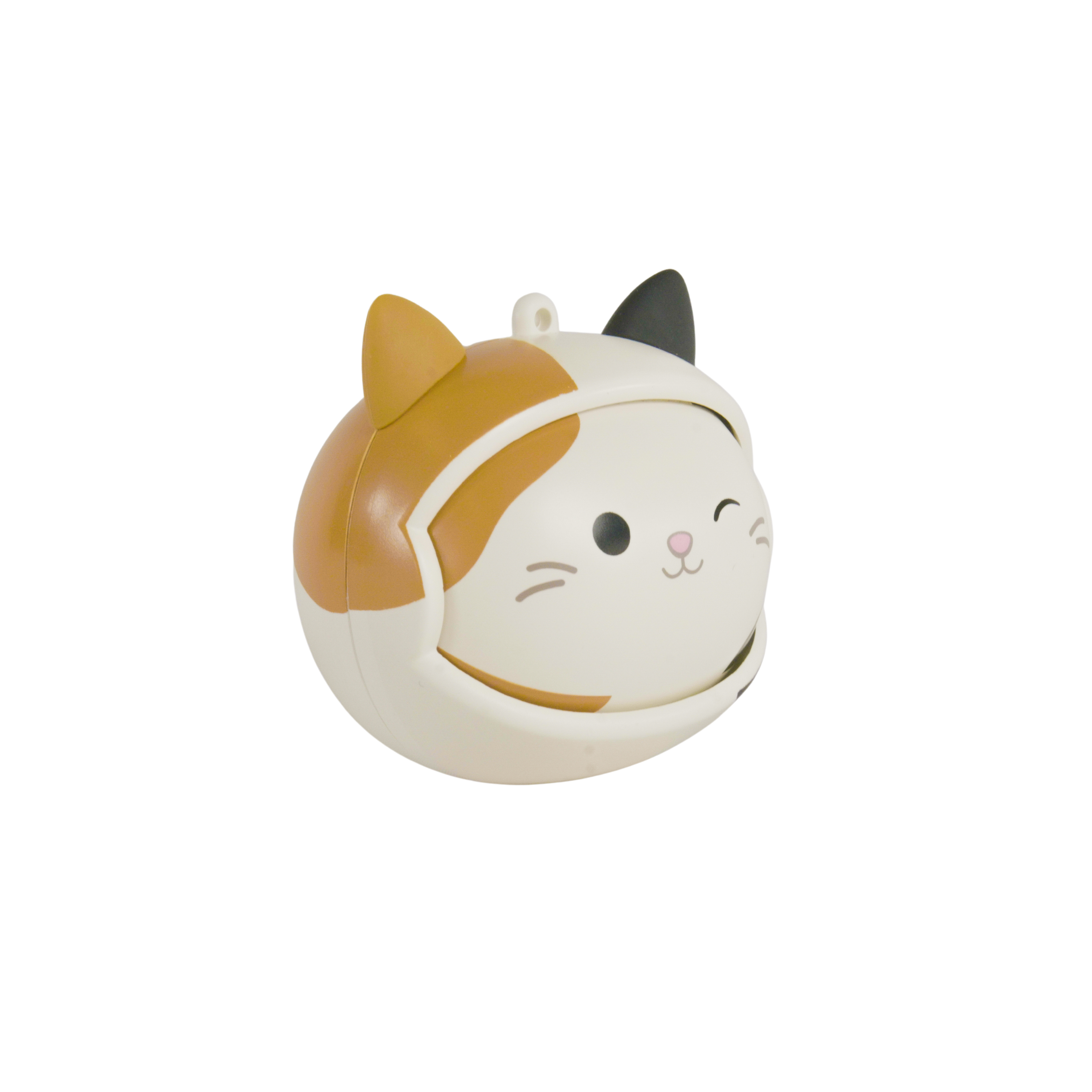 A cat-shaped toy with a winking face, wearing a helmet-like cover with orange and black details, set against a white backdrop.