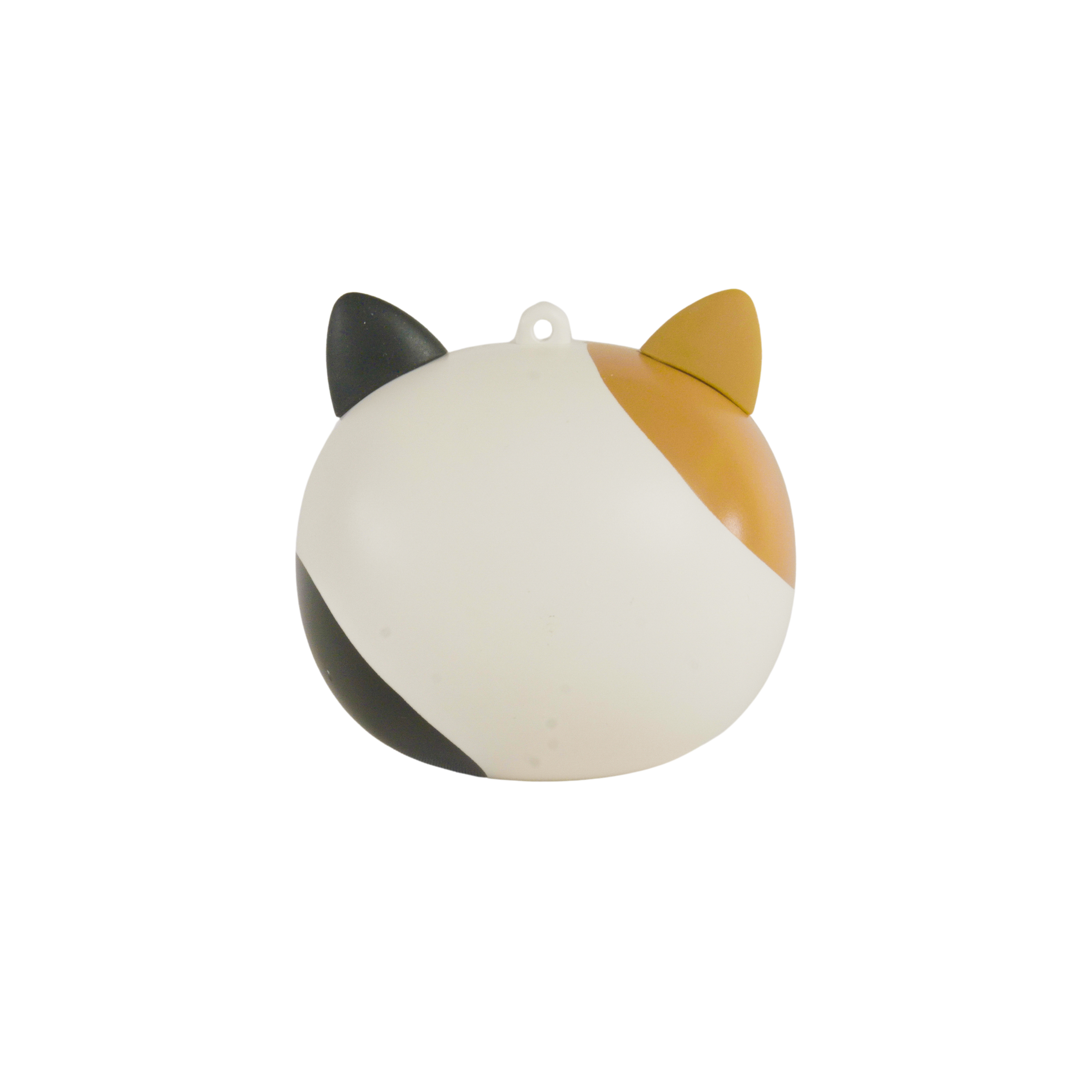 A cat-shaped ornament with black, white, and orange sections. It has two ears and a loop for hanging, set against a white backdrop.