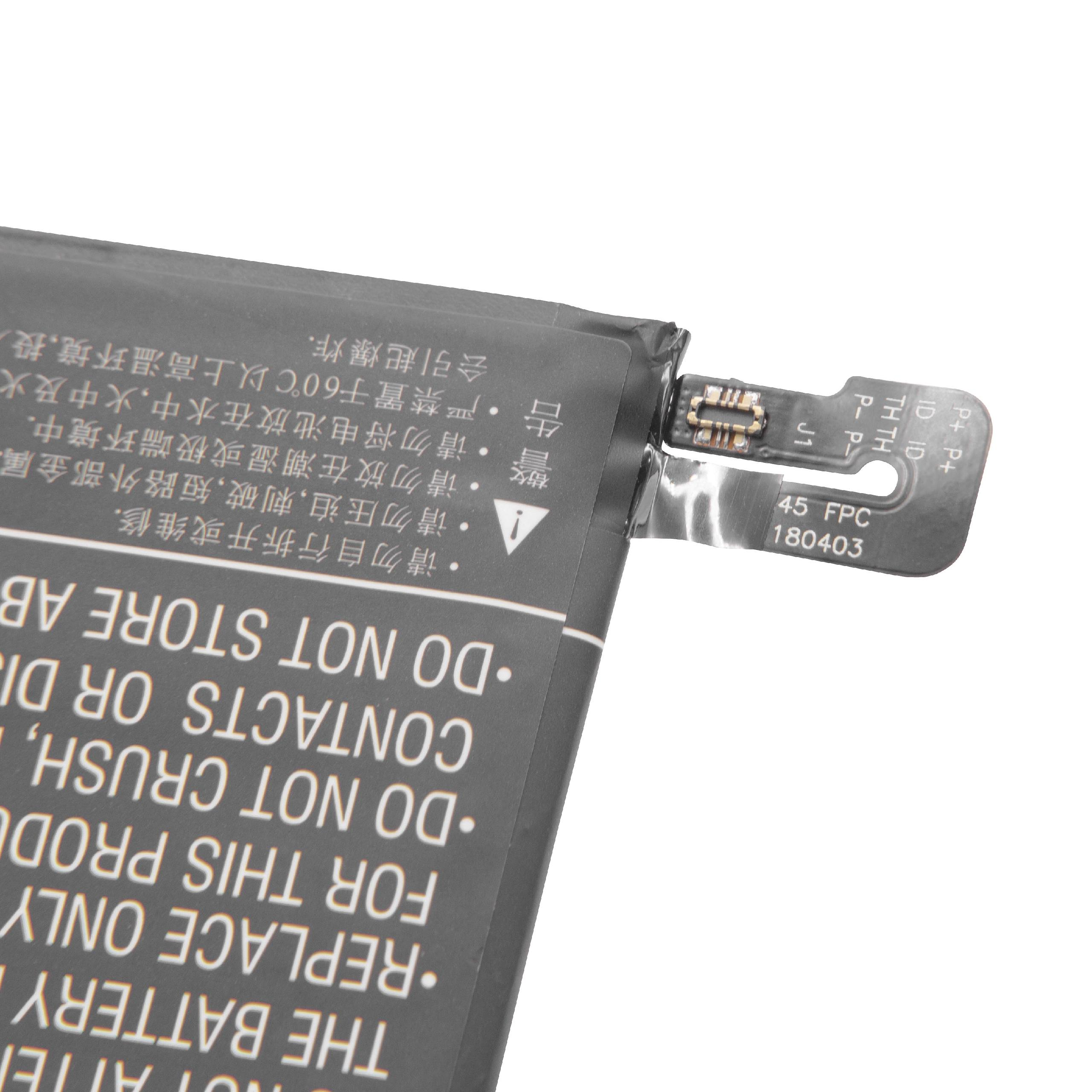 Nahaufnahme einer Batterie mit Textwarnungen und einer kleinen Platine.