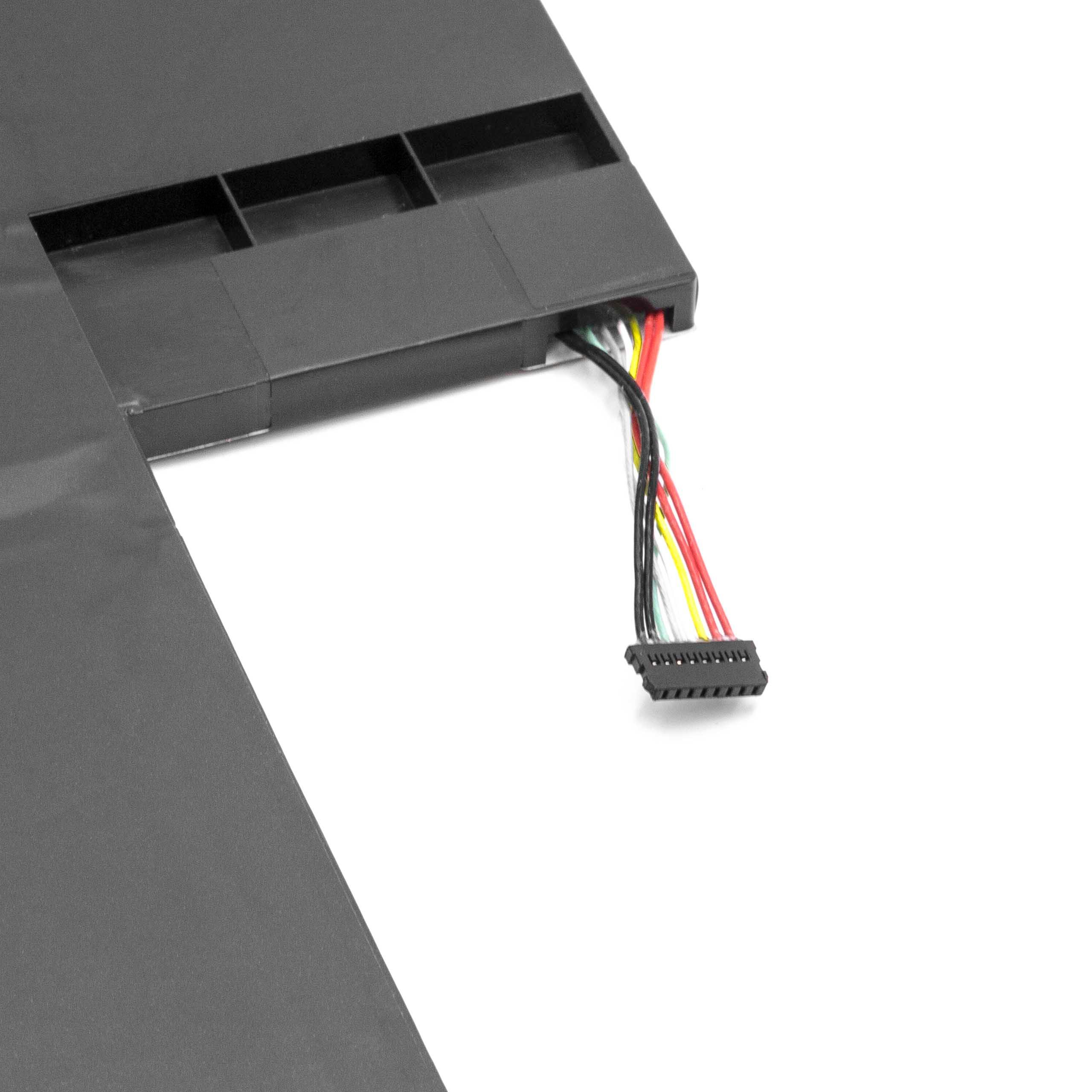 Ein schwarzes elektronisches Bauteil mit mehrfarbigen Drähten und Stecker liegt auf einer weißen Oberfläche.