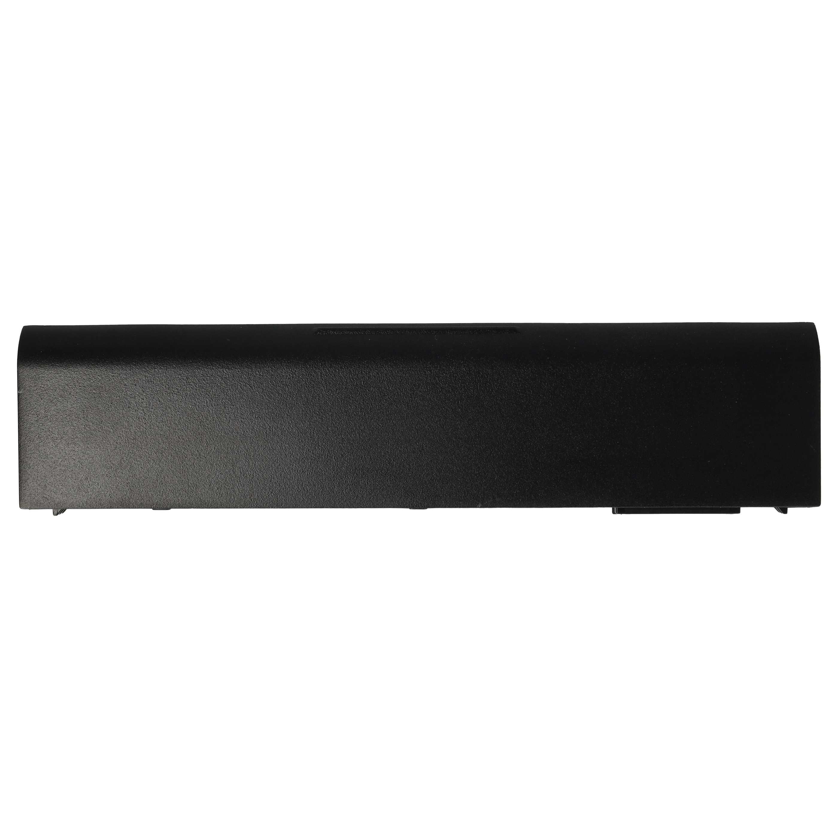 Un oggetto rettangolare nero, forse una batteria per laptop, centrato su sfondo bianco.