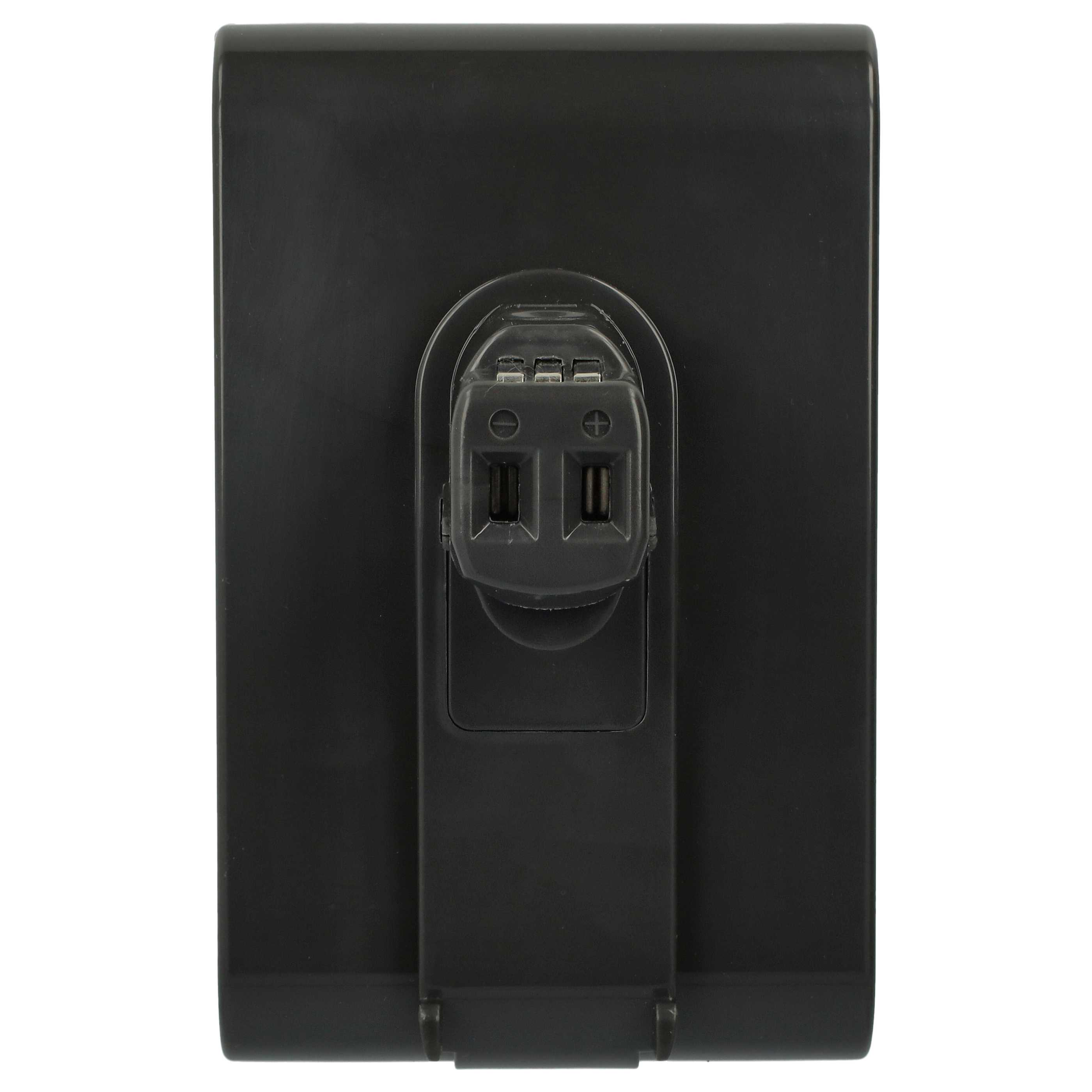 Eine schwarze Ladegerätkomponente mit Ladeanschluss und elektrischen Kontakten vor weißem Hintergrund.