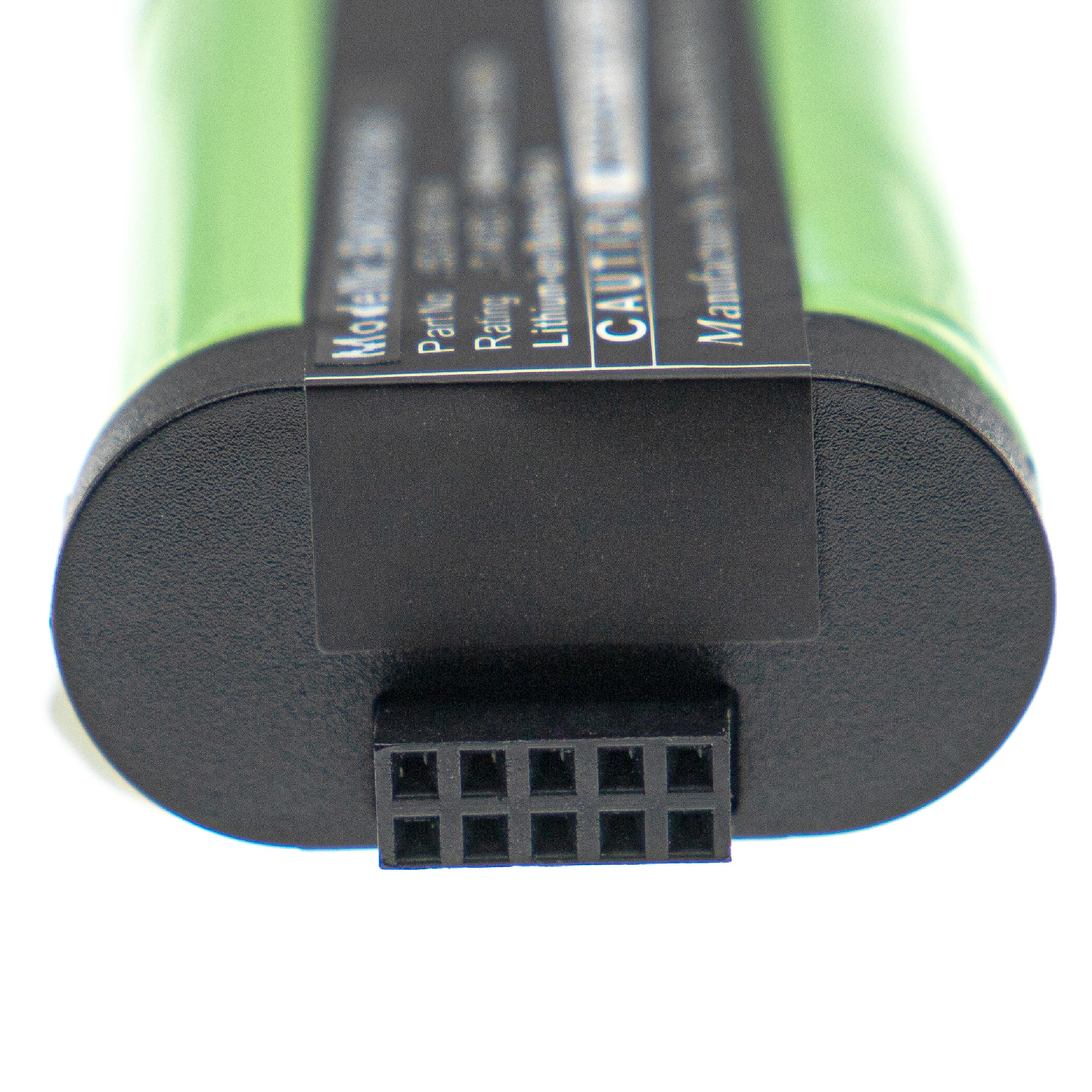 Nahaufnahme eines Akkus mit grünem Oberteil, schwarzer Basis und einem 8-poligen Stecker. Etiketten mit Text sind sichtbar.