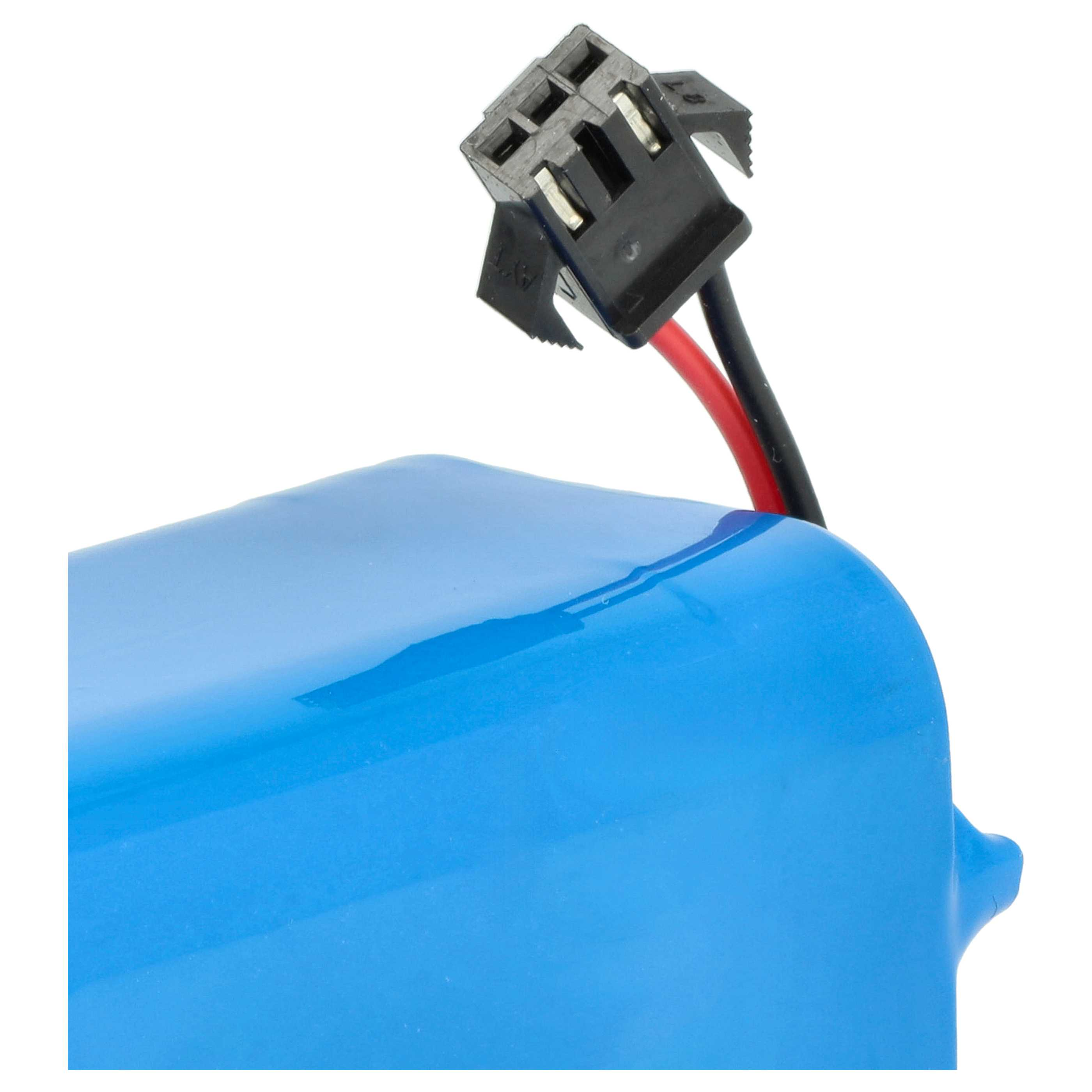 Ein blaues zylindrisches Objekt mit einem schwarzen Stecker und roten/schwarzen Drähten. Der Hintergrund ist weiß.