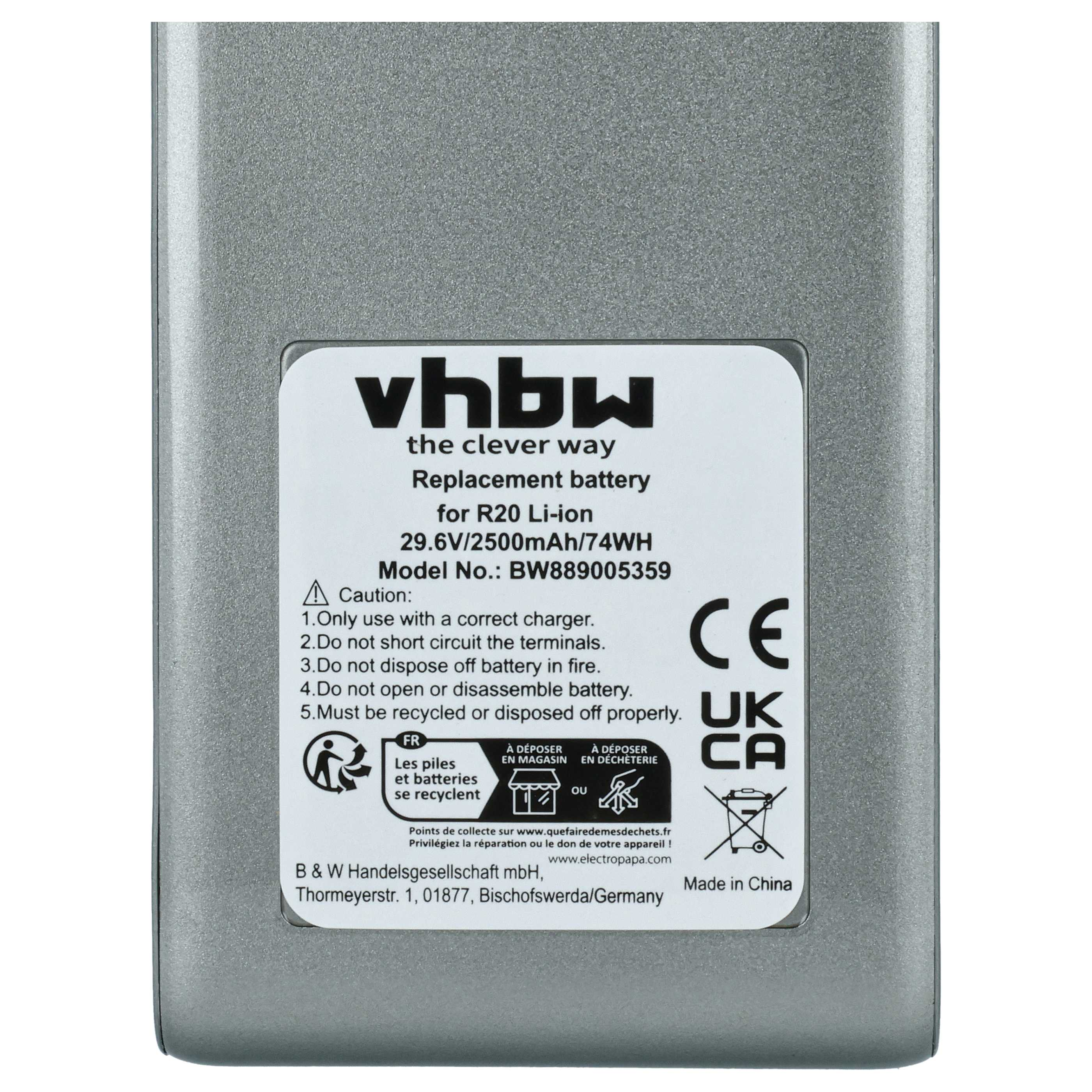 Graue Batterie mit weißem Etikett. Text auf dem Etikett besagt, dass es sich um eine Ersatzbatterie handelt.