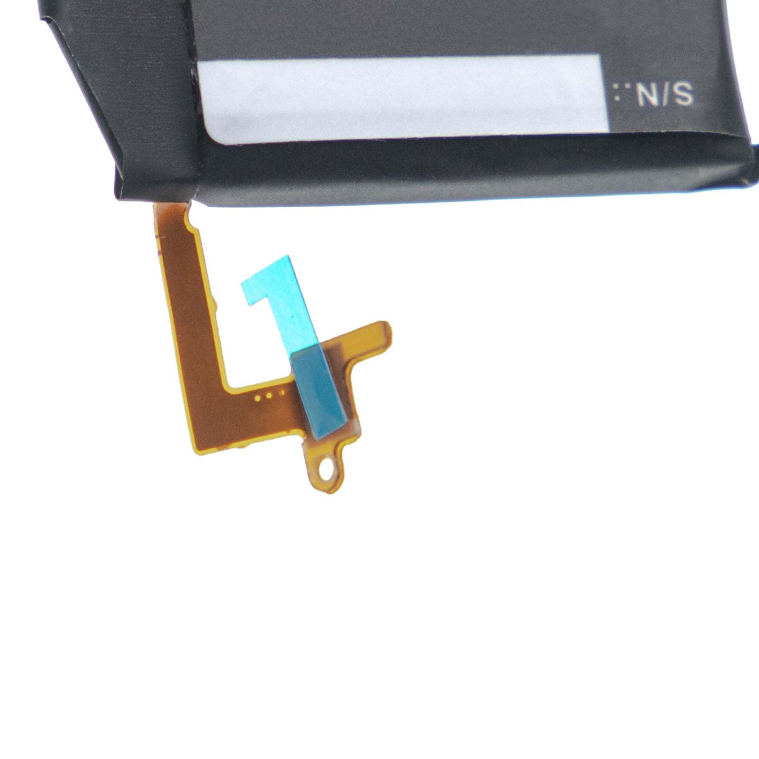 Ein schwarzes und braunes elektronisches Bauteil mit einem blauen Teil und einem weißen Hintergrund. Das Bauteil hat N/S-Text.