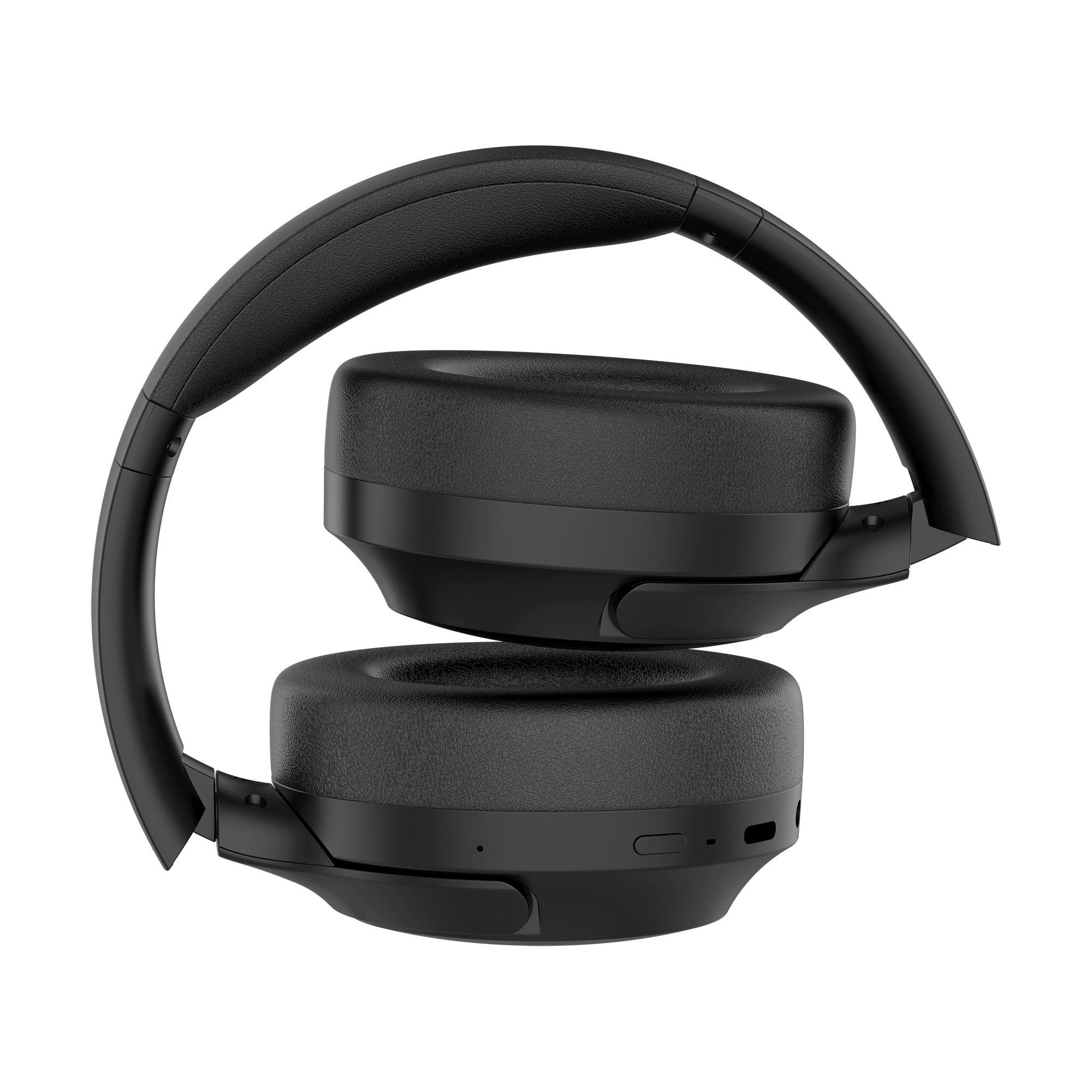 Czarne słuchawki, złożone. Widoczne nauszniki i pałąk. Tło to wzorzysta faktura.