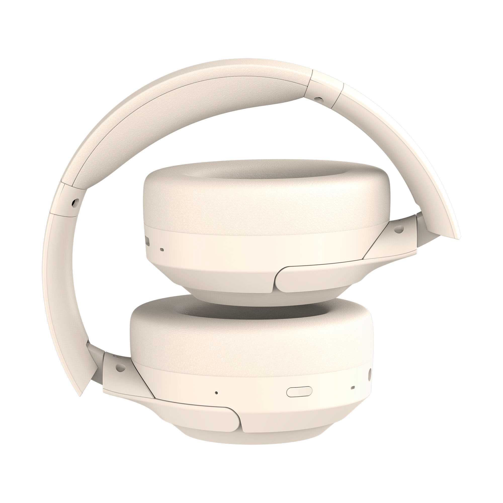 Beżowe słuchawki, złożone. Pałąk zakrzywia się nad nausznikami. Nauszniki są ułożone jeden na drugim. Widoczne przyciski i otwory.