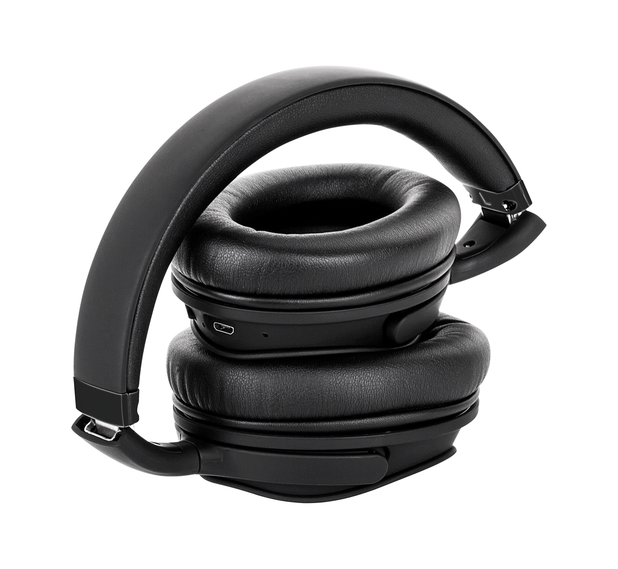 Czarne, złożone słuchawki. Muszle nałożone na siebie, z wyściełanym pałąkiem. Tło to jasnoszare przejście tonalne.