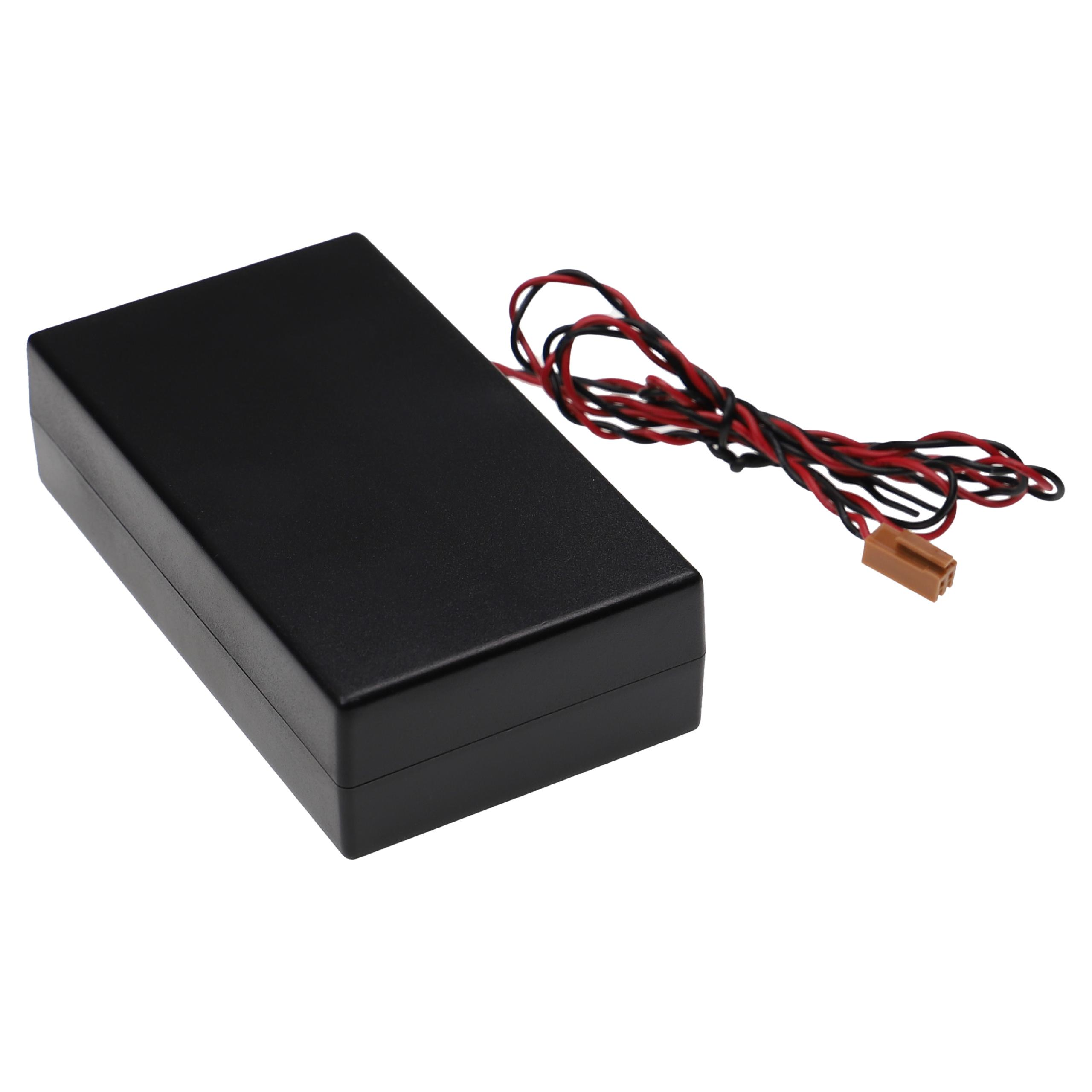 Eine schwarze, rechteckige elektronische Komponentenbox mit roten und schwarzen Drähten und einem braunen Stecker auf weißem Hintergrund.