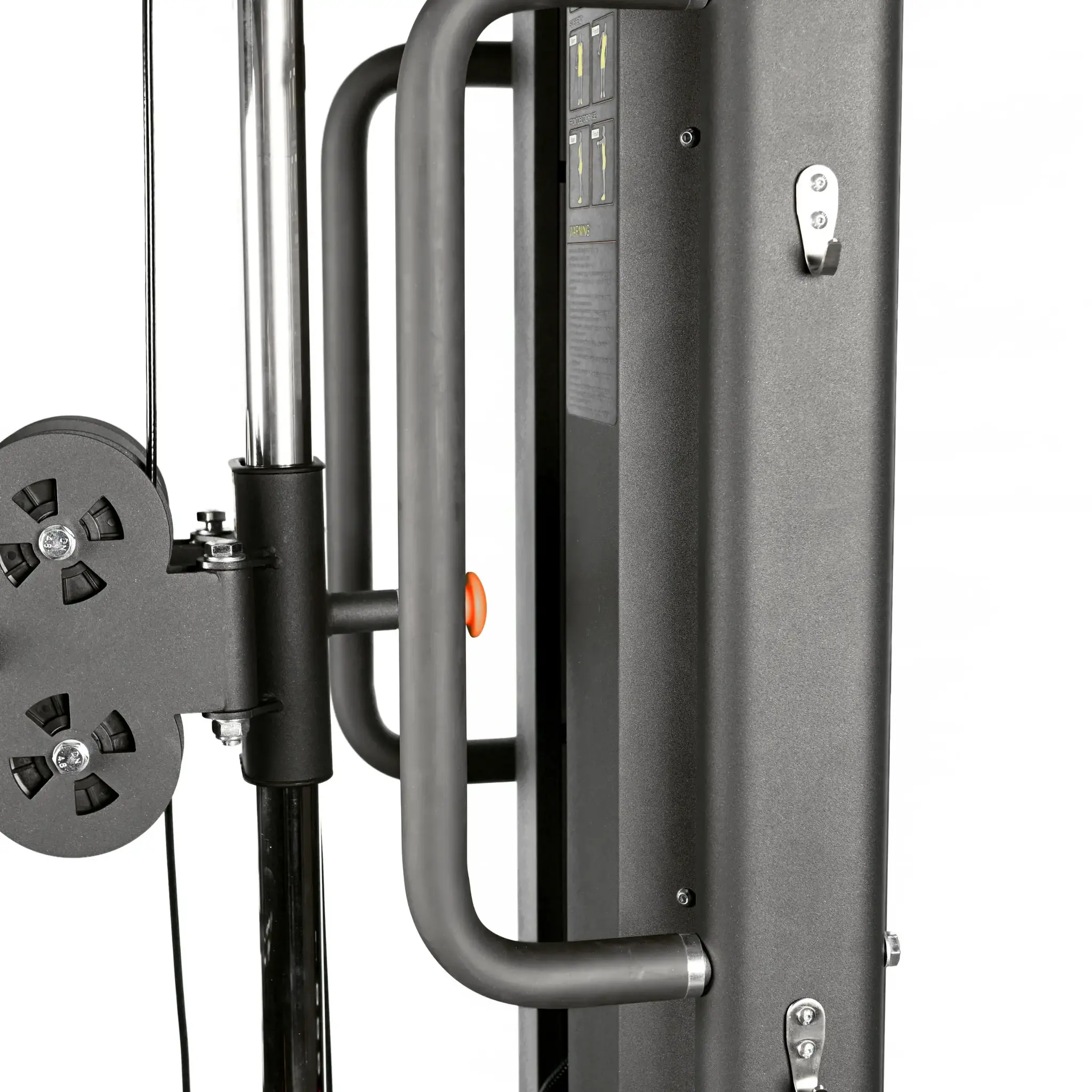 Close-up of a gym machine. Features include a handle, a pulley system, and a dark gray metal frame against a white background.