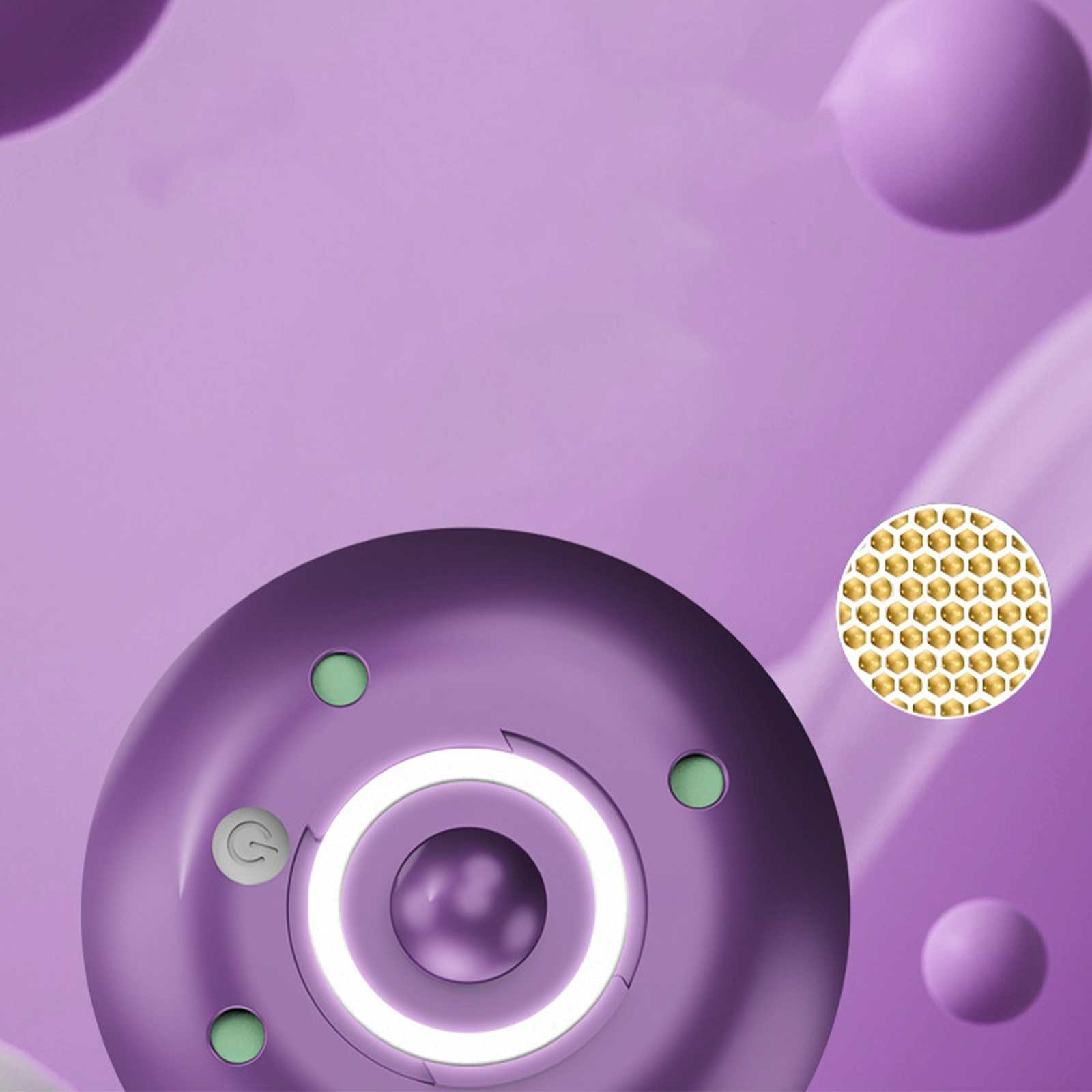 Ein lila Gerät mit kreisförmigem Design, grünen Knöpfen und einem leuchtenden weißen Ring. Daneben ein Cluster goldener Punkte.