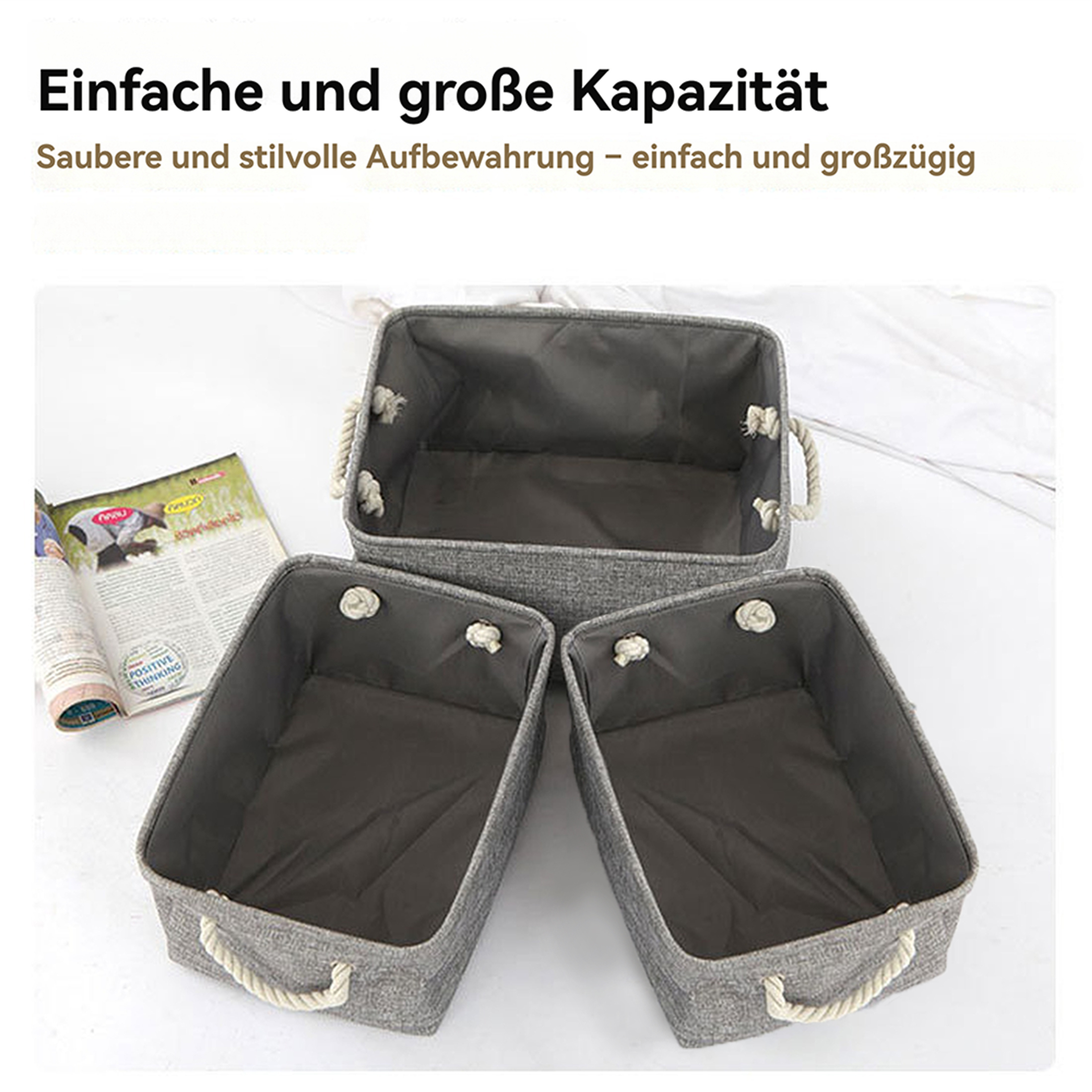 Drei graue Aufbewahrungskörbe mit Seilgriffen. Links ist eine offene Zeitschrift. Weißer Hintergrund.